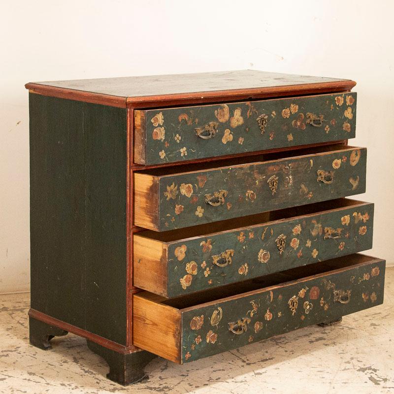 Once in awhile, we find an extra special piece that gets us excited and this chest of drawers is one of them. Why? It is the original painted finish, with the many flowers portrayed on each of the 4 drawers, and wonderful overall condition of the
