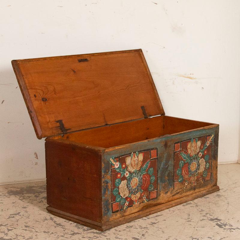 It is the bright floral bouquets that attracts one to this delightful old trunk or blanket chest from Hungary. The paint is all original and a reflection of the traditional folk art style of the period and desire to bring color and beauty from the