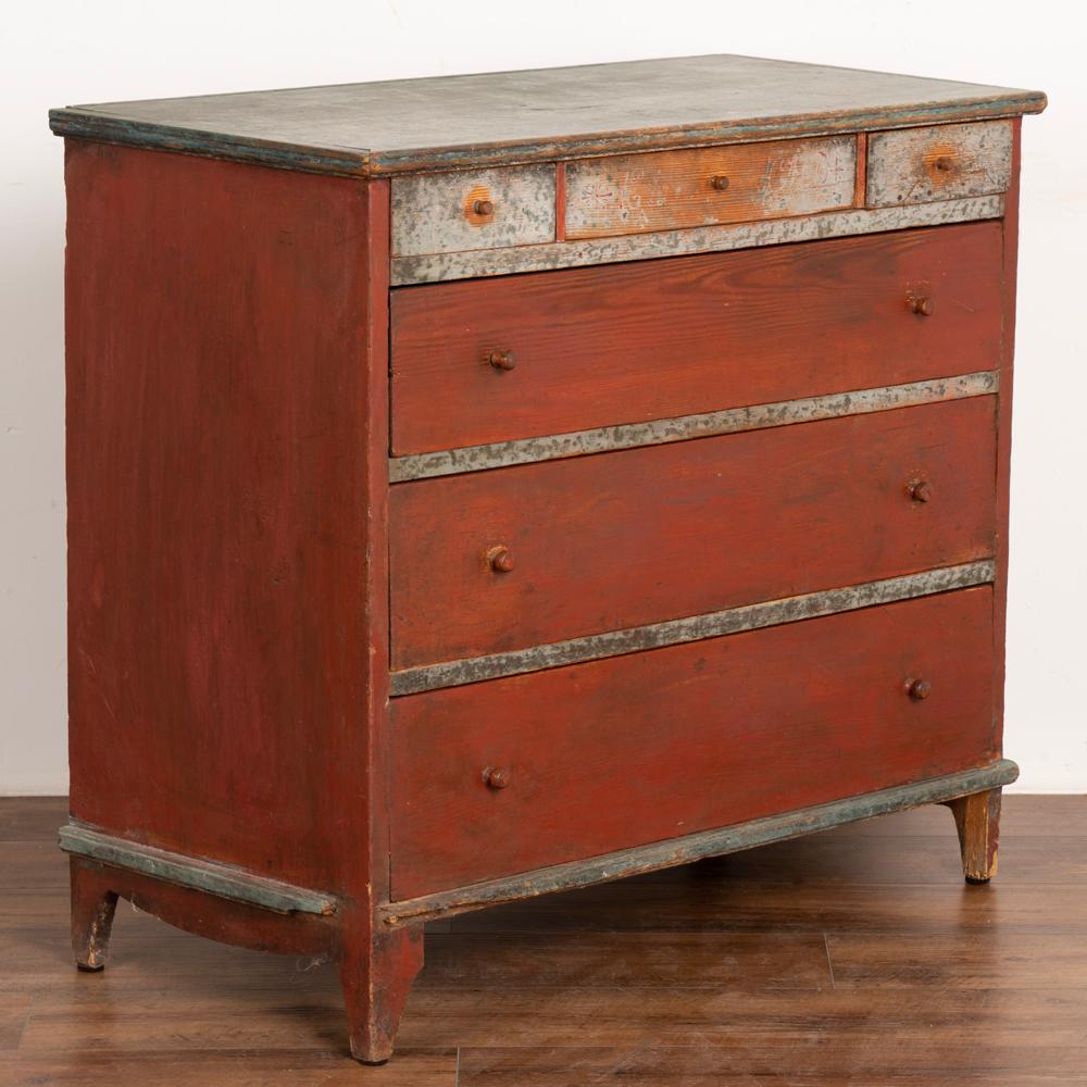 It is the all original painted finish that makes this chest of drawers from the Swedish countryside a special find.
Note the original brick red paint accented with the blue/green/white folk art accents all faded and worn to the warm pine patina