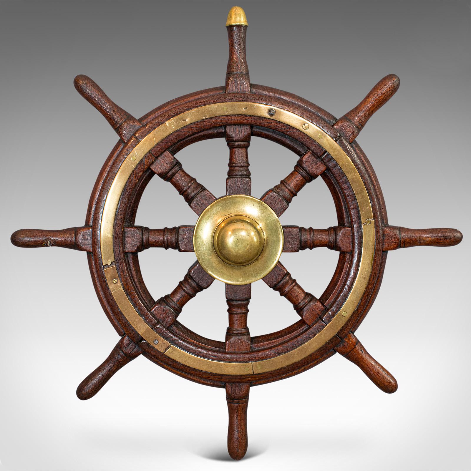 This is an antique original ship's wheel. An English, oak maritime collectable helm, dating to the Victorian period, circa 1900.

Appealing maritime display piece
Displays a desirable aged patina
Solid oak shows fine grain interest and