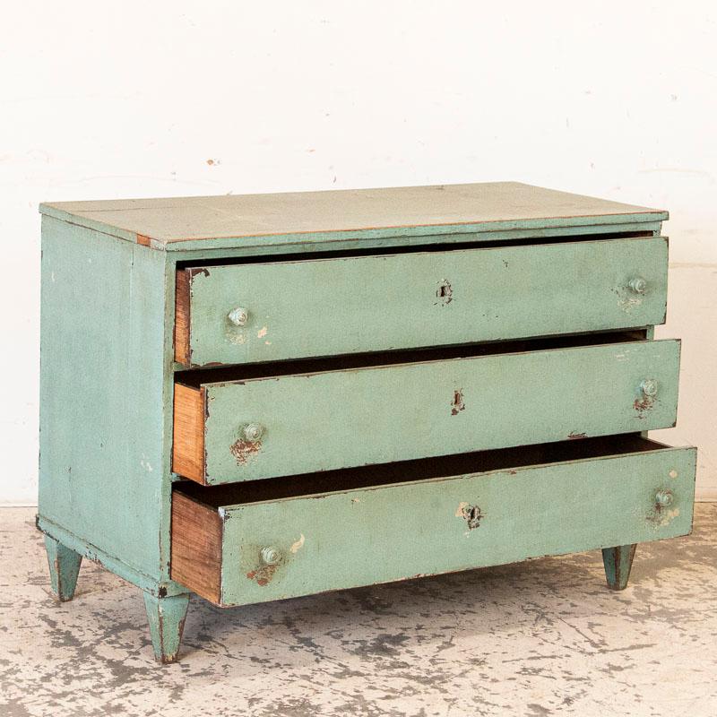 There are two specific features that make this wonderful chest of drawers rather special. The first is the unusual shade of aqua/teal green which is quite enchanting in person. The second is the size itself, most chest of drawers of this era would