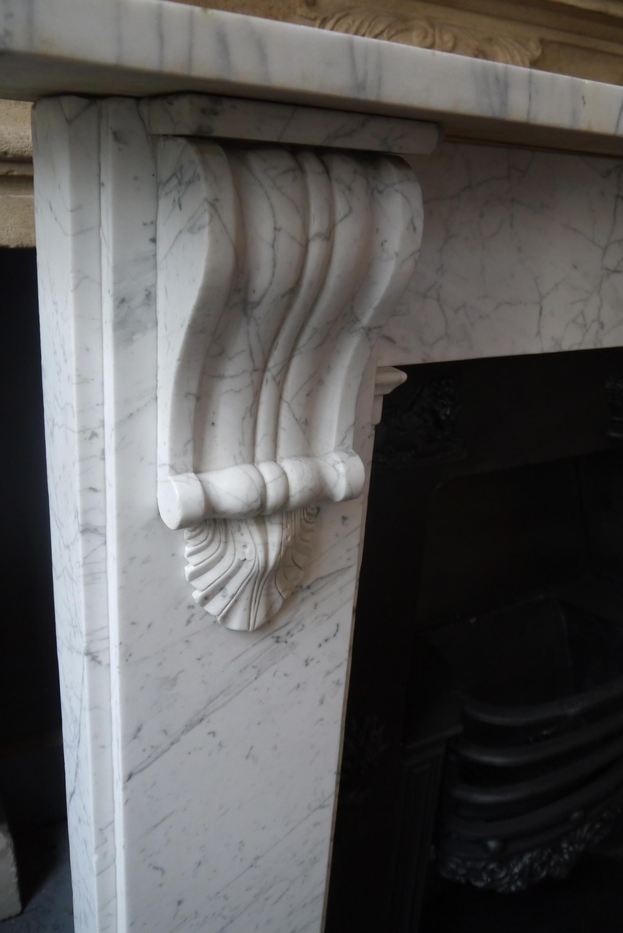 Original antique beautifully veined Victorian Carrara marble corbel surround. Measures: Opening 39.75