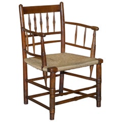 Antica poltrona originale William Morris Sussex Rope Seat vista al V&A Museum