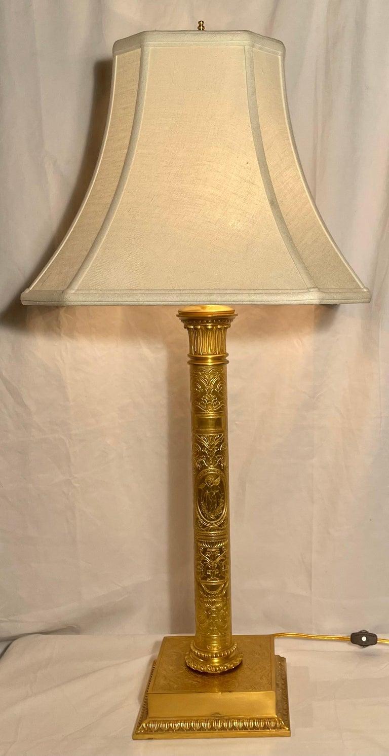 Antique ormolu lamp with detailed etching on column, by 