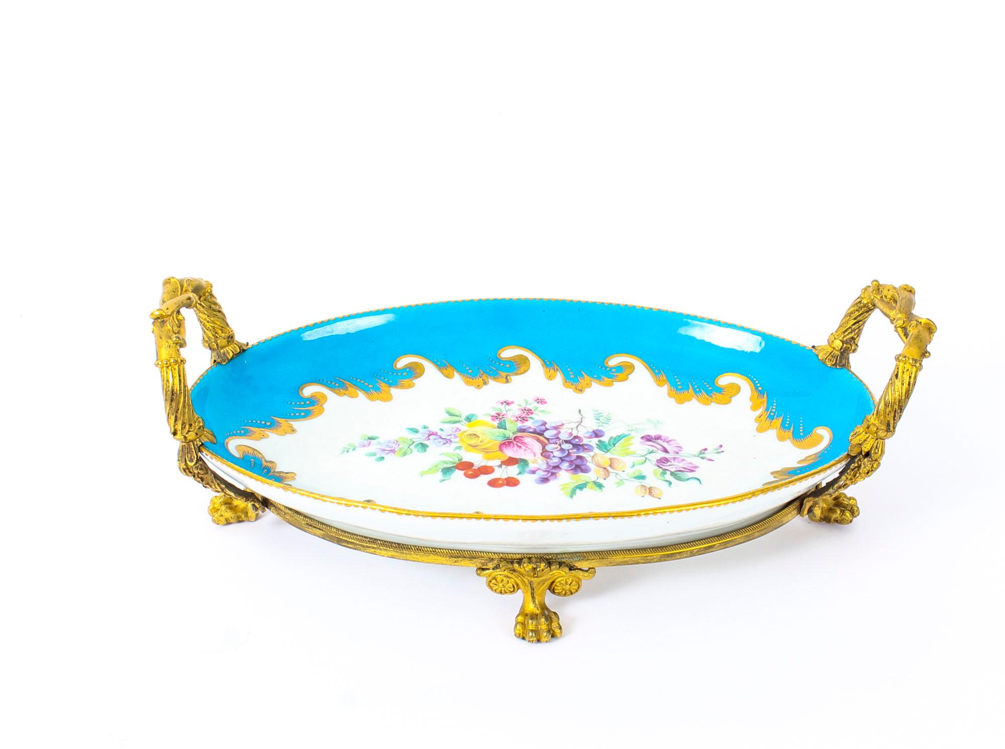This is a wonderful antique French ormolu mounted Sevres Bleu Celeste porcelain centrepiece, circa 1860 in date.
 
This striking centrepiece features a delightful oval bowl with exquisite entwined branchwork ormolu handles. The interior is