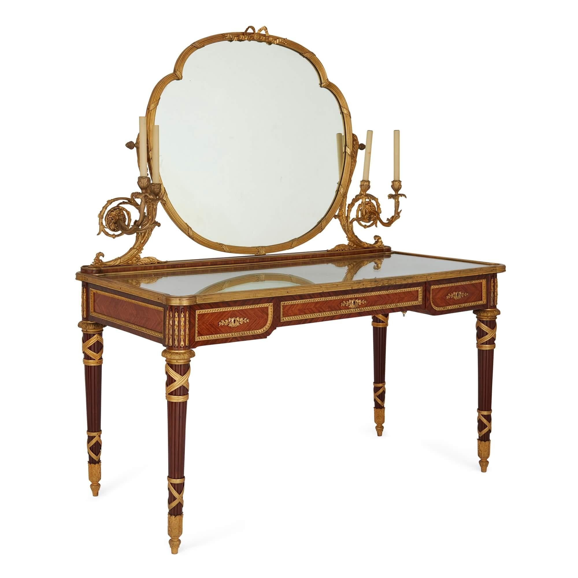Antique ormolu mounted dressing table by Zwiener Jansen Successeur 
French, c. 1900 
Height 153cm, width 134cm, depth 63cm 

Superbly crafted by the renowned French firm Zwiener Jansen Successeur, the dressing table is adorned with unusual features