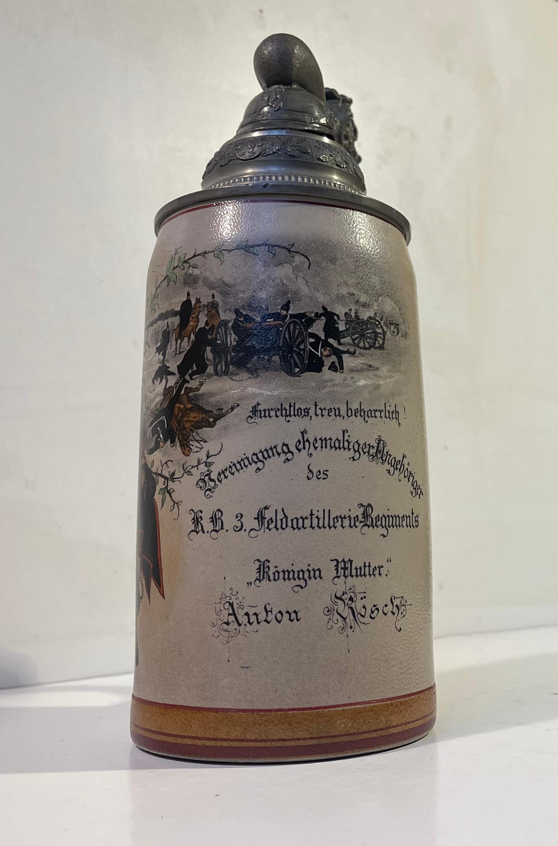 Very detailed ornamental Imperial German Bier Stein hand-painted with WW1 scene commemorative of KB3 Feldartillerie Regiment. The pewter top features the Bavarian Lion and the imperial German Fireman's Helmet. Its corpus is made from stoneware and