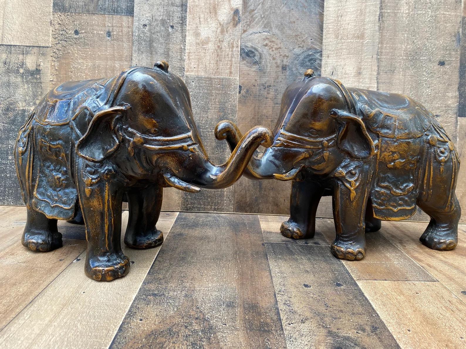 Antique Ornate Bronze Elephants - Pair

Decorate your mantlepiece or side/coffee tables with these bronze elephant sculptures. The elephants are adorned with saddles and head gear. These are perfect for your asian modern or modern private or