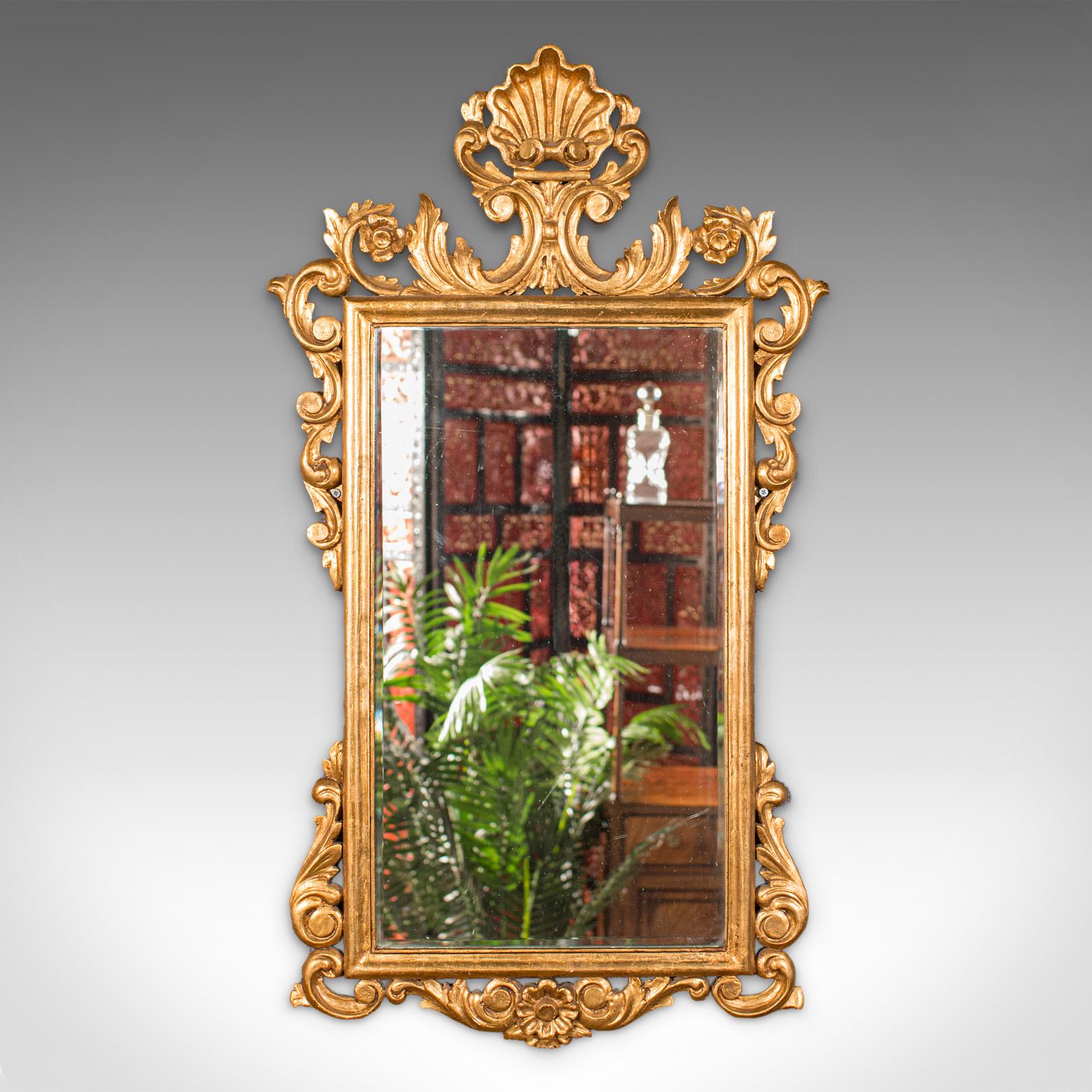 This is an ornate antique mirror. A Continental, giltwood and glass hall or overmantle mirror, dating to the late Victorian period, circa 1890.

Expressive show frame adds a wonderful decorative appeal
Displaying a desirable aged patina - frame in
