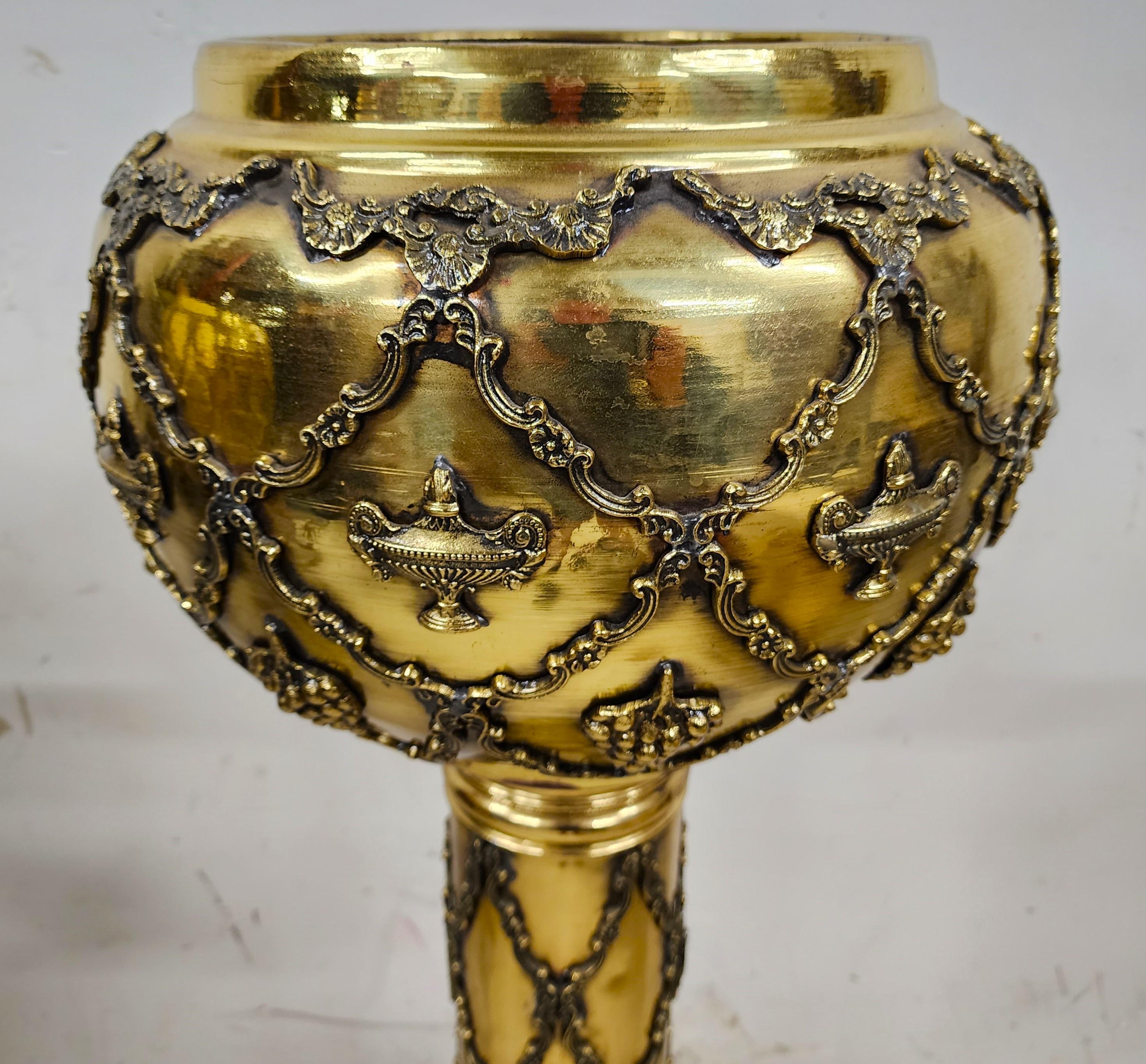 For FULL item description click on CONTINUE READING at the bottom of this page.

Offering one of our recent palm beach estate fine furniture acquisitions of a
set of 2 antique ornate pedestal brass planter stands
They have different but similar