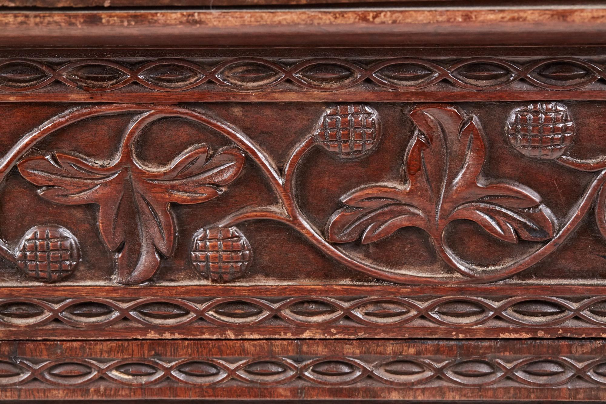Antique ornate small carved Anglo-Indian padauk inverted breakfront pedestal sideboard. This fine piece is very ornately carved all over with so many fine features. The inverted breakfront top has a gadrooned edge, three beautifully carved drawers