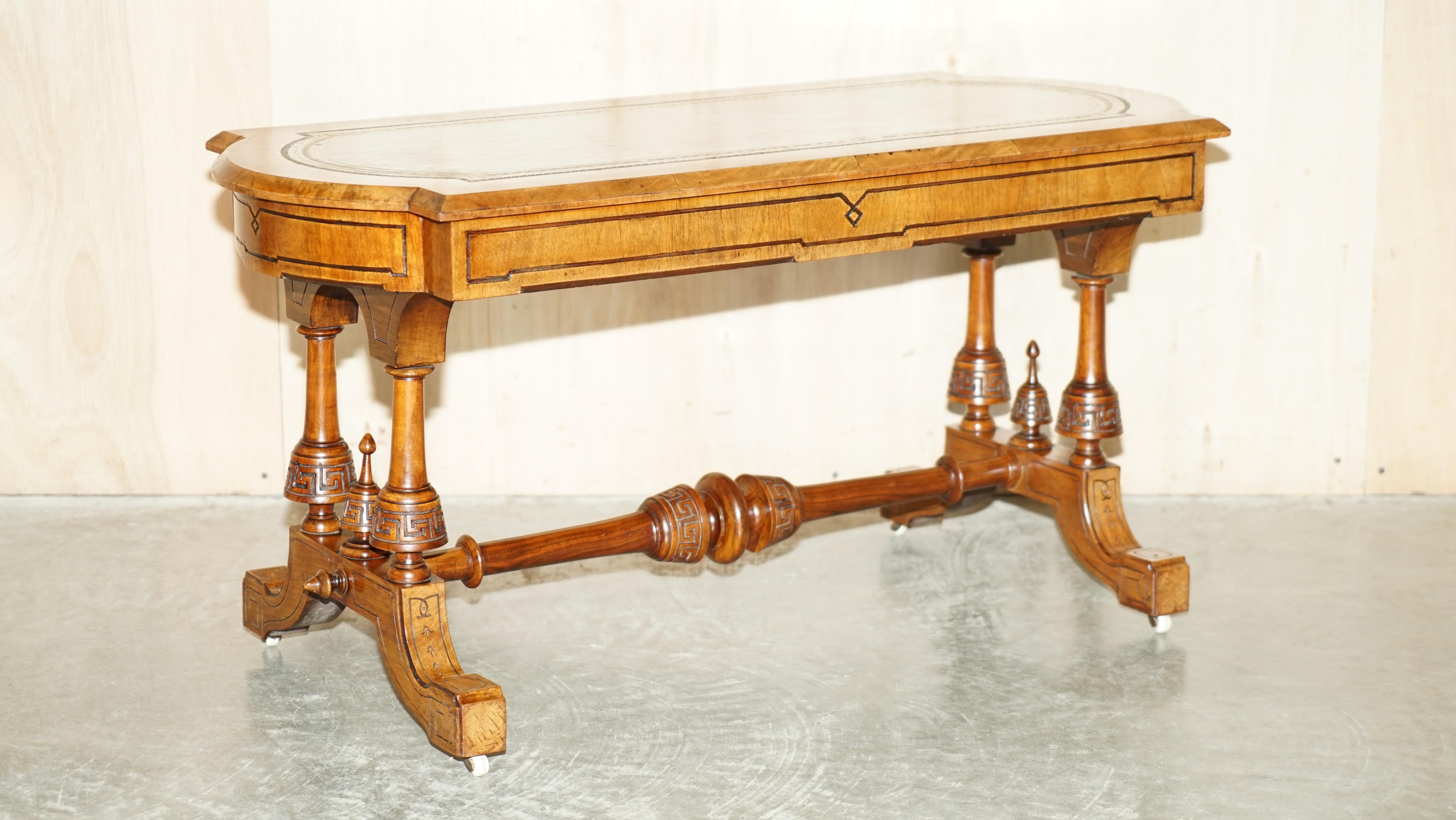 We are delighted to offer for sale this stunning heavily carved Aesthetic Movement style Burr & Burl Walnut coffee table with green Leather top 

A very good looking and well made table, this is super decorative and looks expensive and important