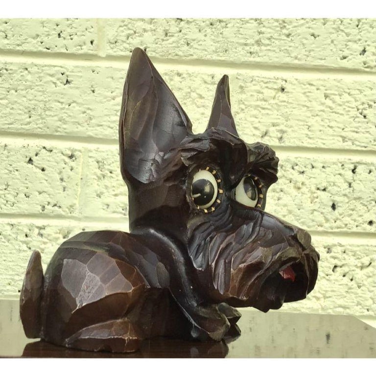 Antique Oswold Rolling/Google Eye Terrier clock

The Little dog with its healthy red tongue has the eyes moving round, changing the expression, as it tells the time.
Left eye denotes the hour and right eye denotes the minutes.
Most of these