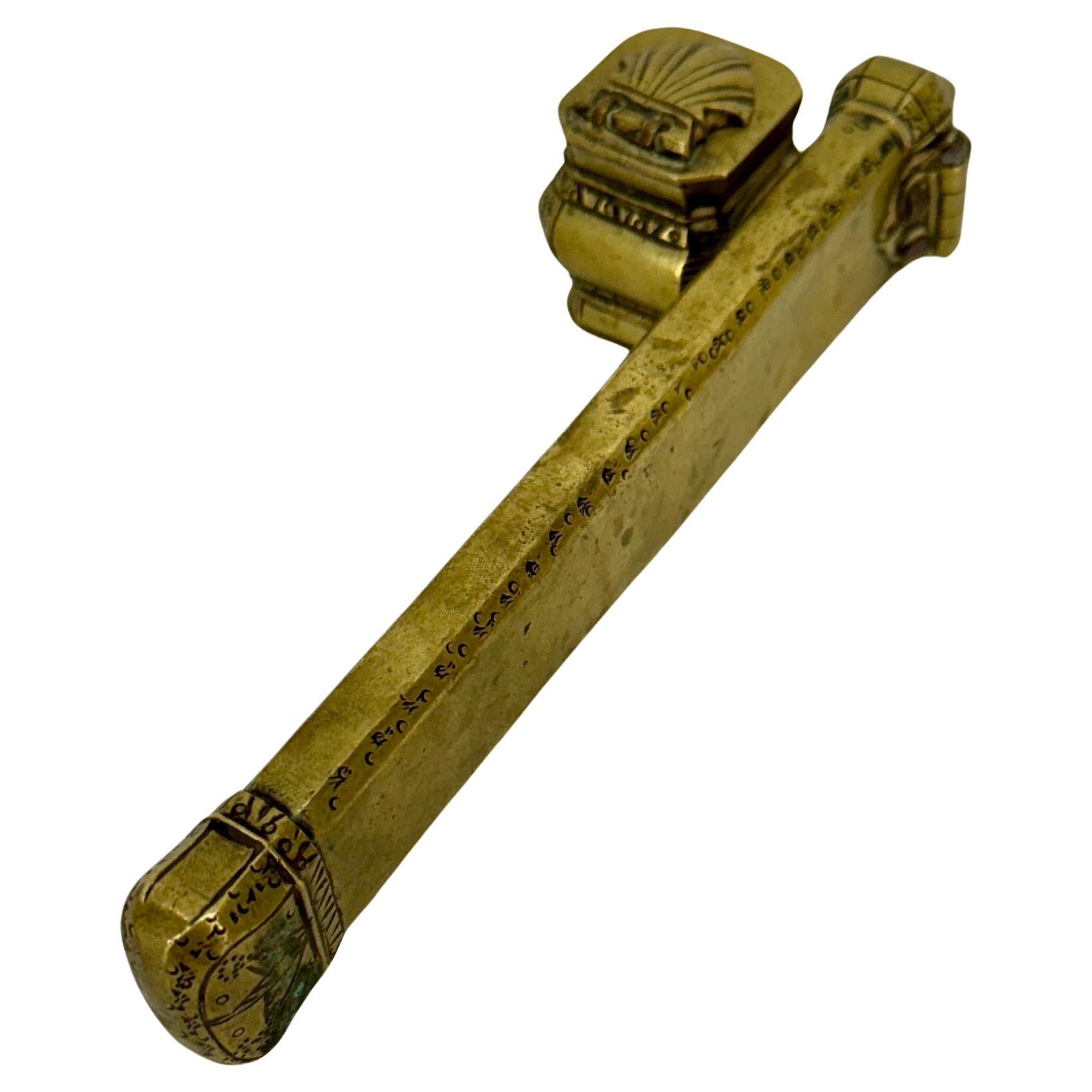 Antique Turkish Brass Pencil Case Qalamdan and Inkwell From The Ottoman Empire

The interior of the brass case is divided into compartments to hold writing tools such as quills and pencils. The compartments are designed to keep the the writing tools