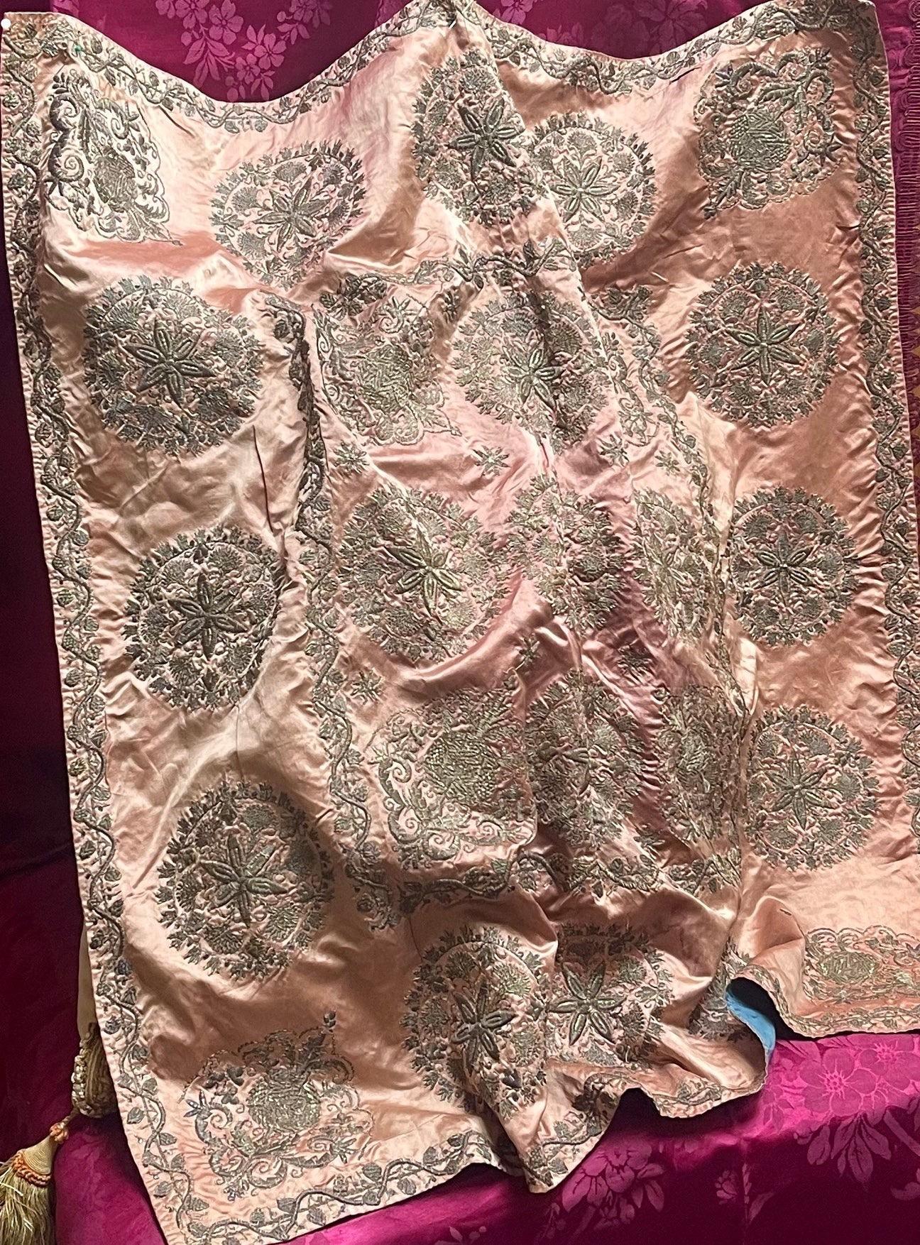 Exquisite Antique Ottoman Cover
The pale peachy pink silk ground has been beautifully worked by hand
over almost its entire surface with the most gorgeous needlework in metallic wrapped threads

Turkish .  Dating from 19th century

Antique gently