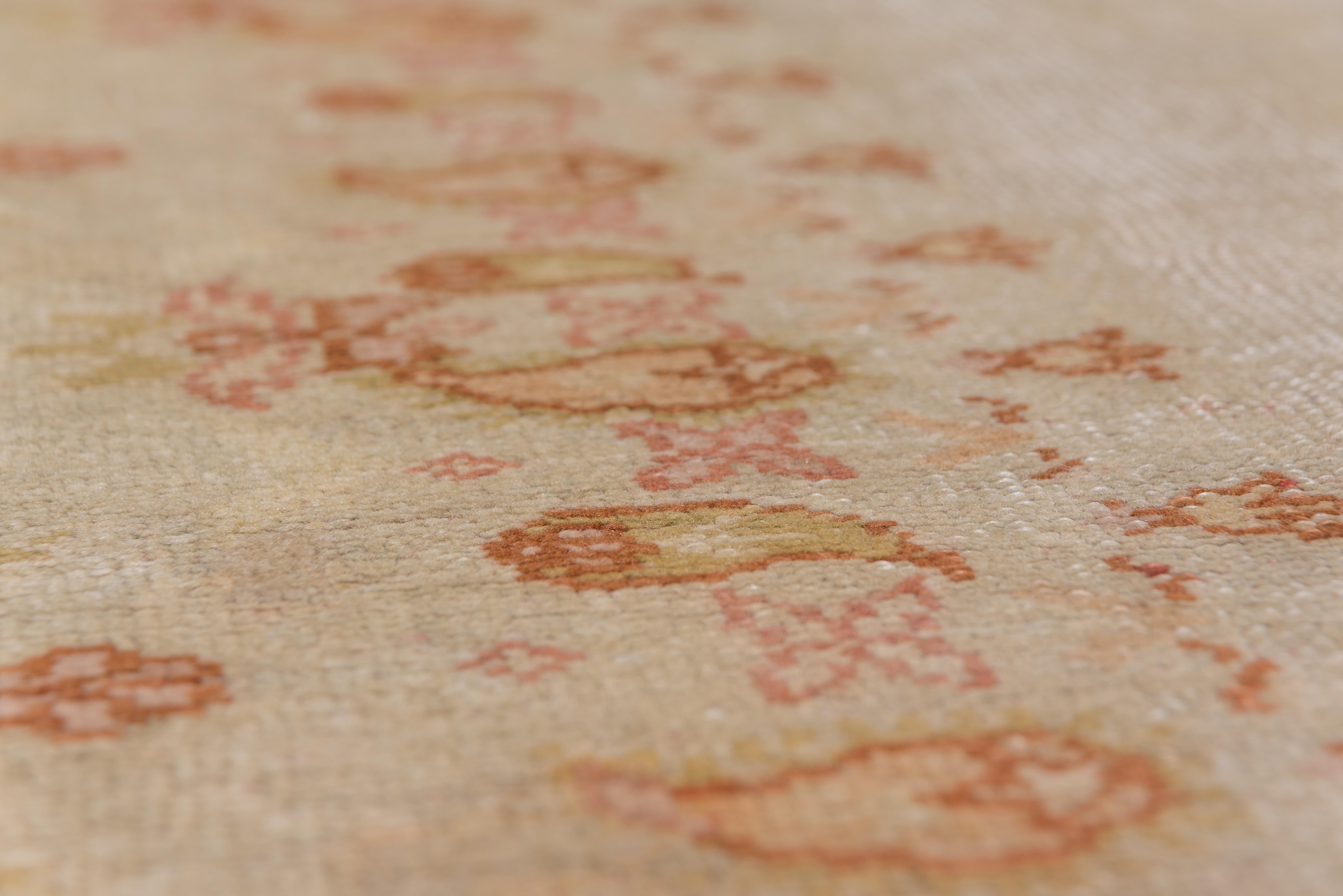 Hand-Knotted Antique Oushak Carpet, Ivory Field, Orange Accents, circa 1920s For Sale