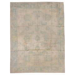 Tapis antique Oushak:: champ ivoire:: bordures turquoises