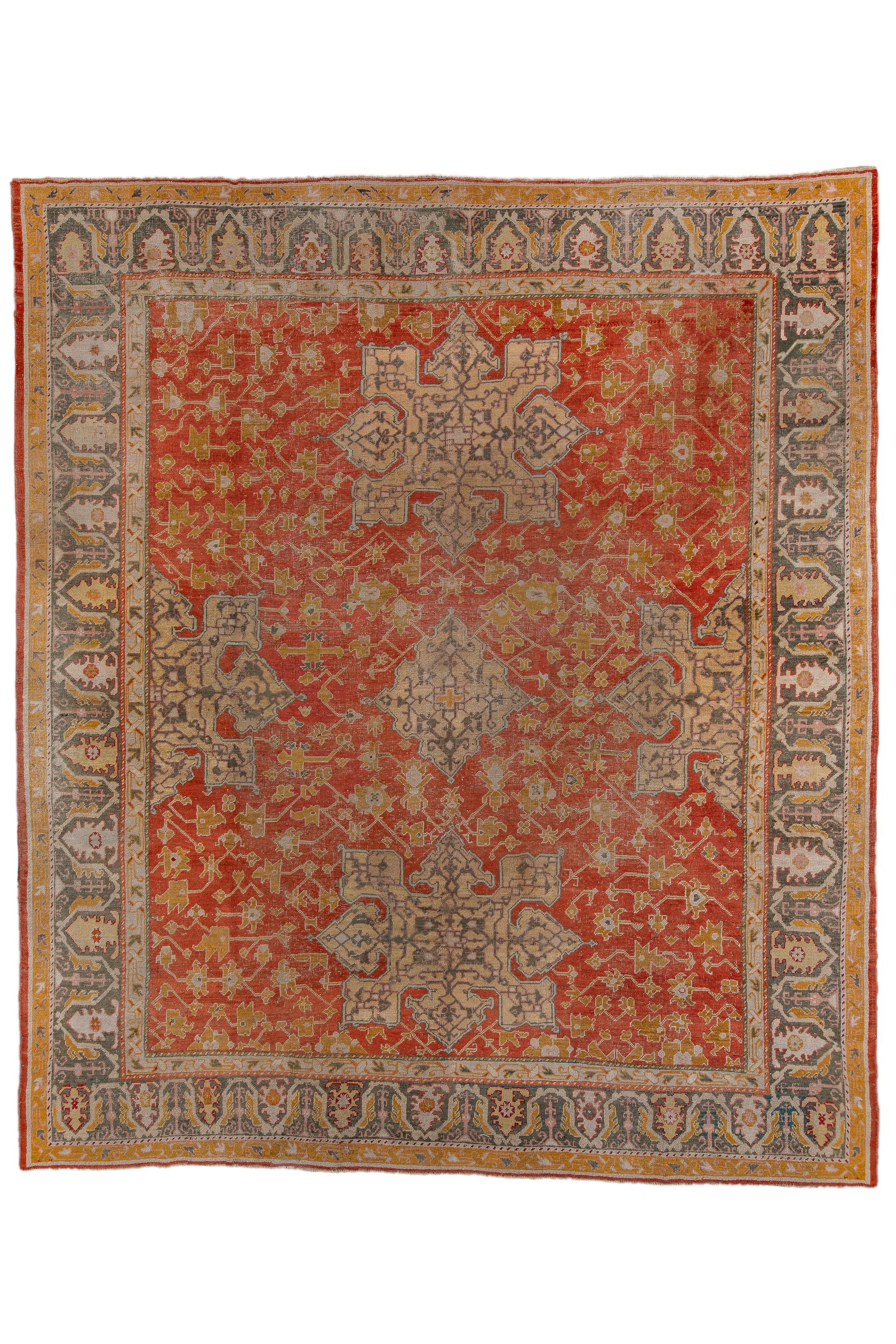 This town carpet is styled in a classic 16th century “Star” design of two complete vertical elements and two lateral half stars, on a Turkey red ground filled with small leafy palmettes and stiff vinery.  Sapphire blue main border with a barbed,