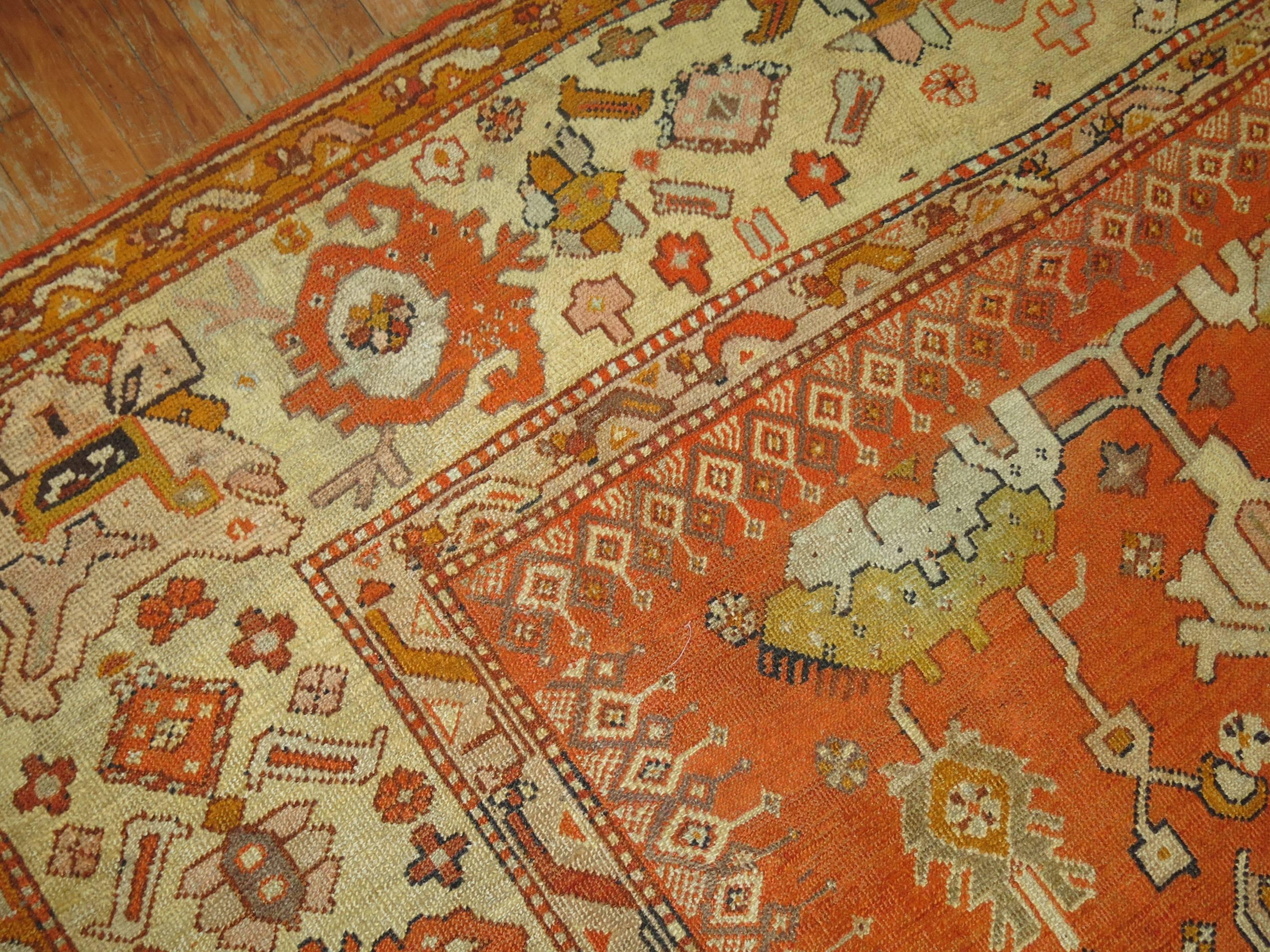 An exhilarating late 19th century antique Turkish Oushak rug in predominant bright orange accents. The finest quality of wool that you can find in any type of rug from this origin.