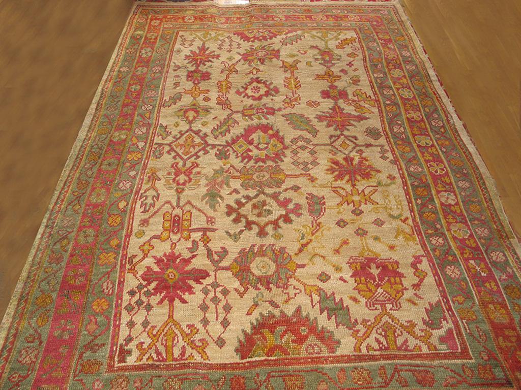 Oushak loves the harshang pattern and any of the 100’s of variants on it. Here the old ivory field of this circa 1900 west Anatolian carpet is decorated with a semi-detached all-over array of palmettes, leaves, lozenges, rosettes and miscellaneous