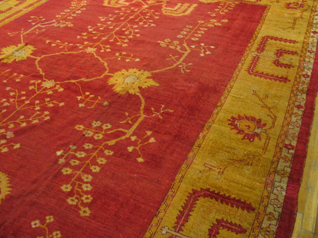 Before English Arts & Crafts carpets copied Oushaks, Oushak did Arts & Crafts, as is abundantly evident in this splendid red circa 1880s rug with wiry flowering vines, abstracted weeping willow elements, and a few large palmettes. The effect is