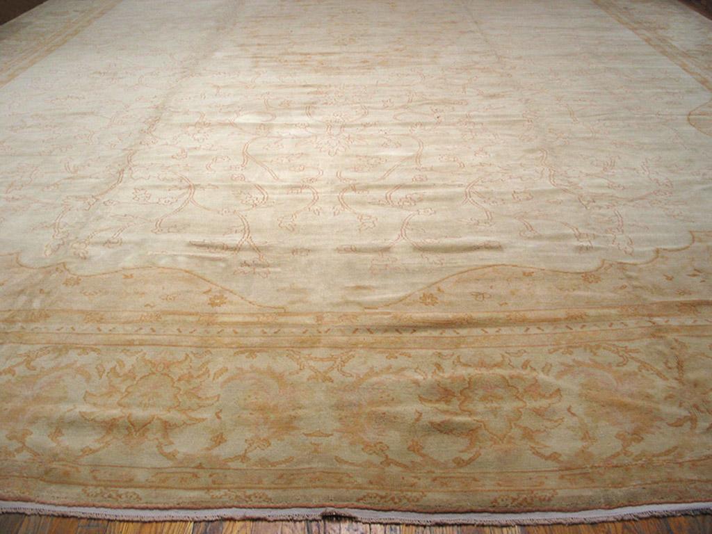Antique Oushak rug, ivory background, measures: 17'2
