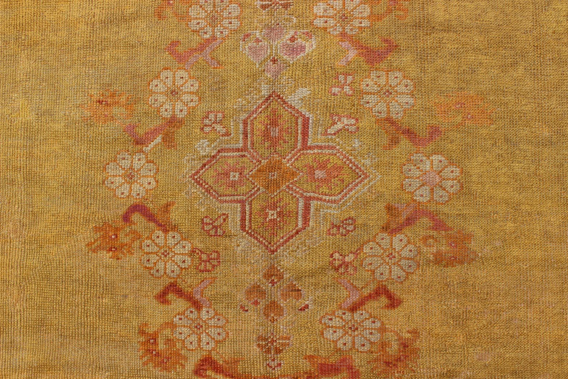 Antique Oushak Rug in Yellow Green Background, Pink Border, Red & Orange Accents For Sale 1