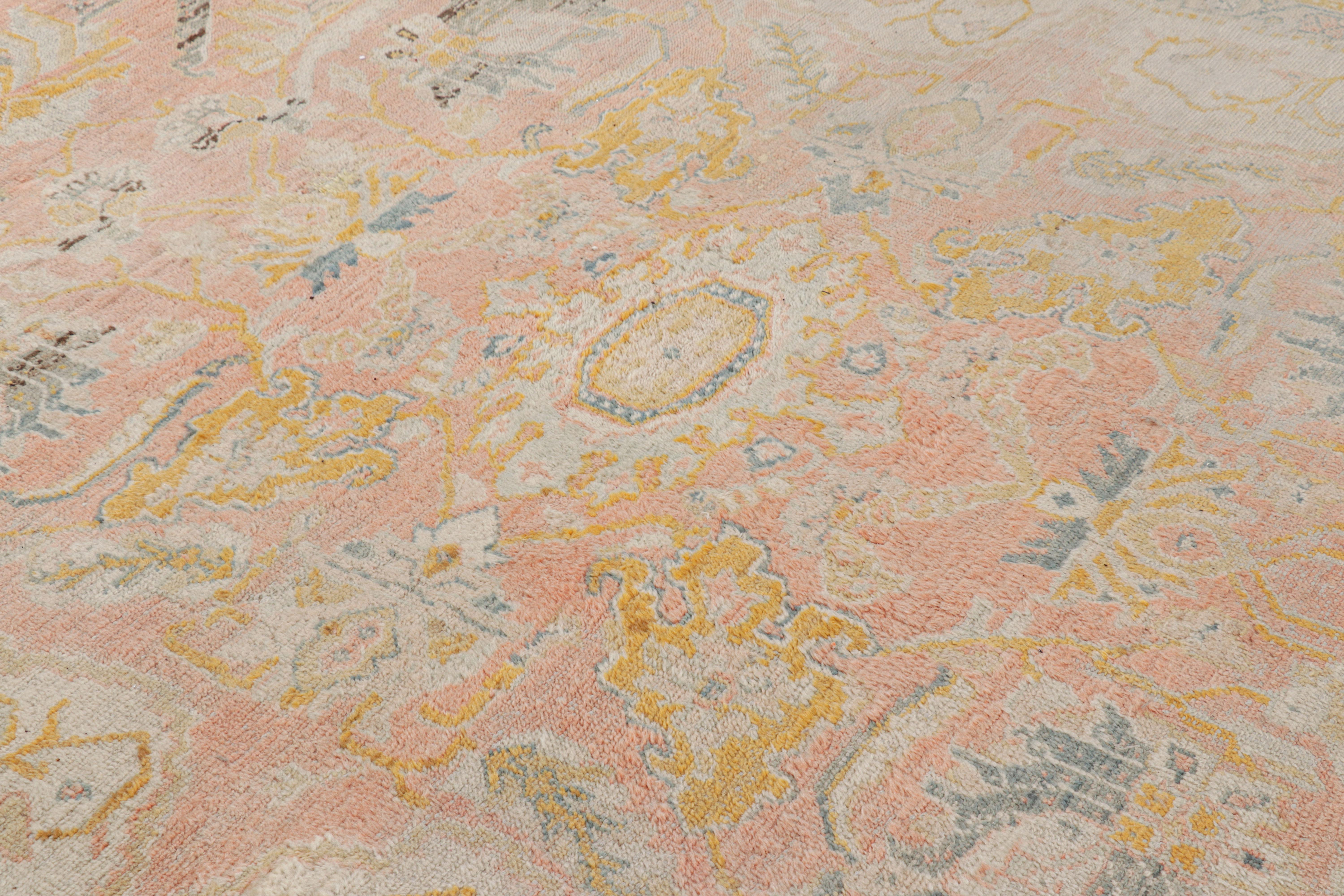 Turkish Antique Oushak Rug in Pink with Blue and Gold Floral Patterns For Sale