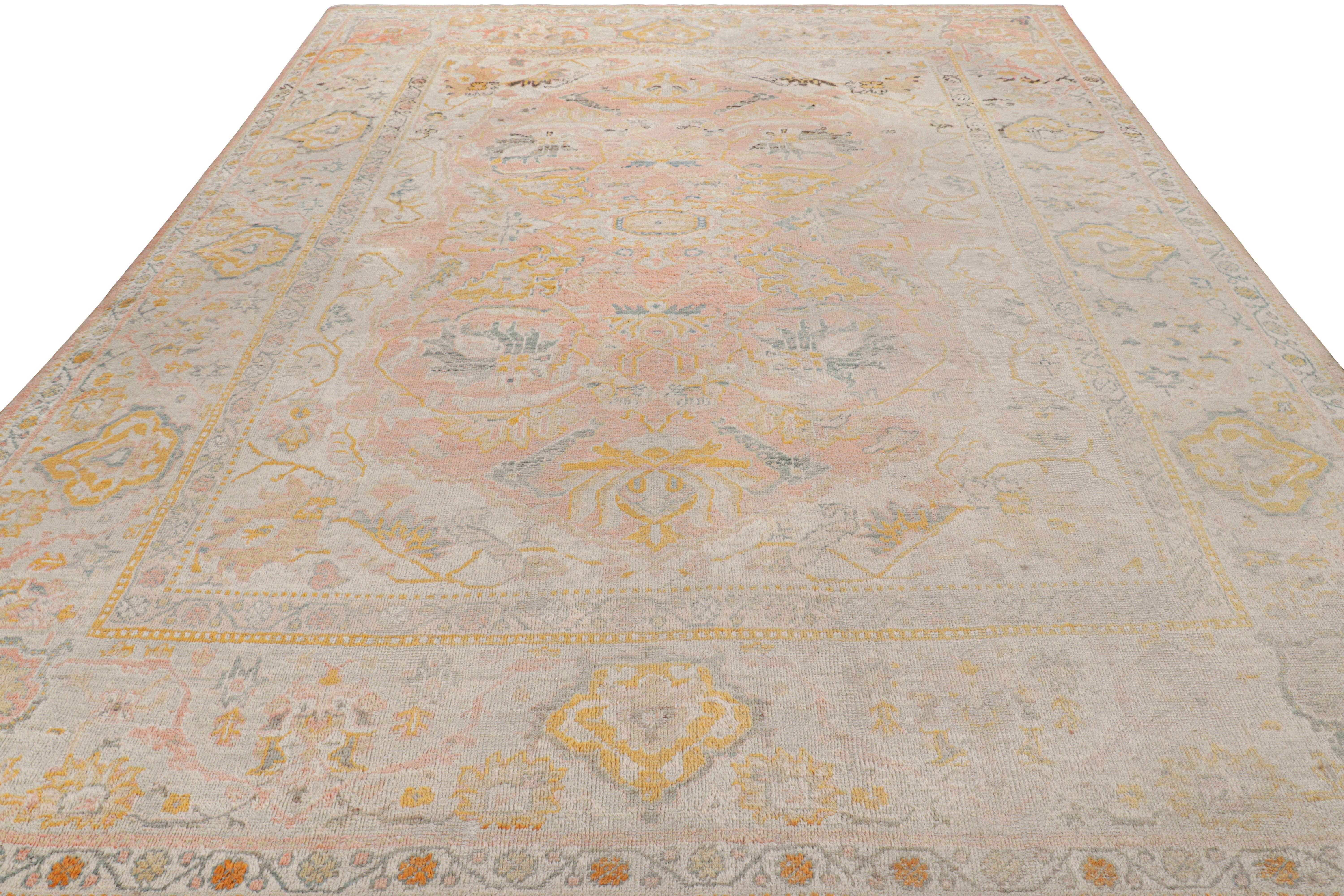Hand-Knotted Antique Oushak Rug in Pink with Blue and Gold Floral Patterns For Sale