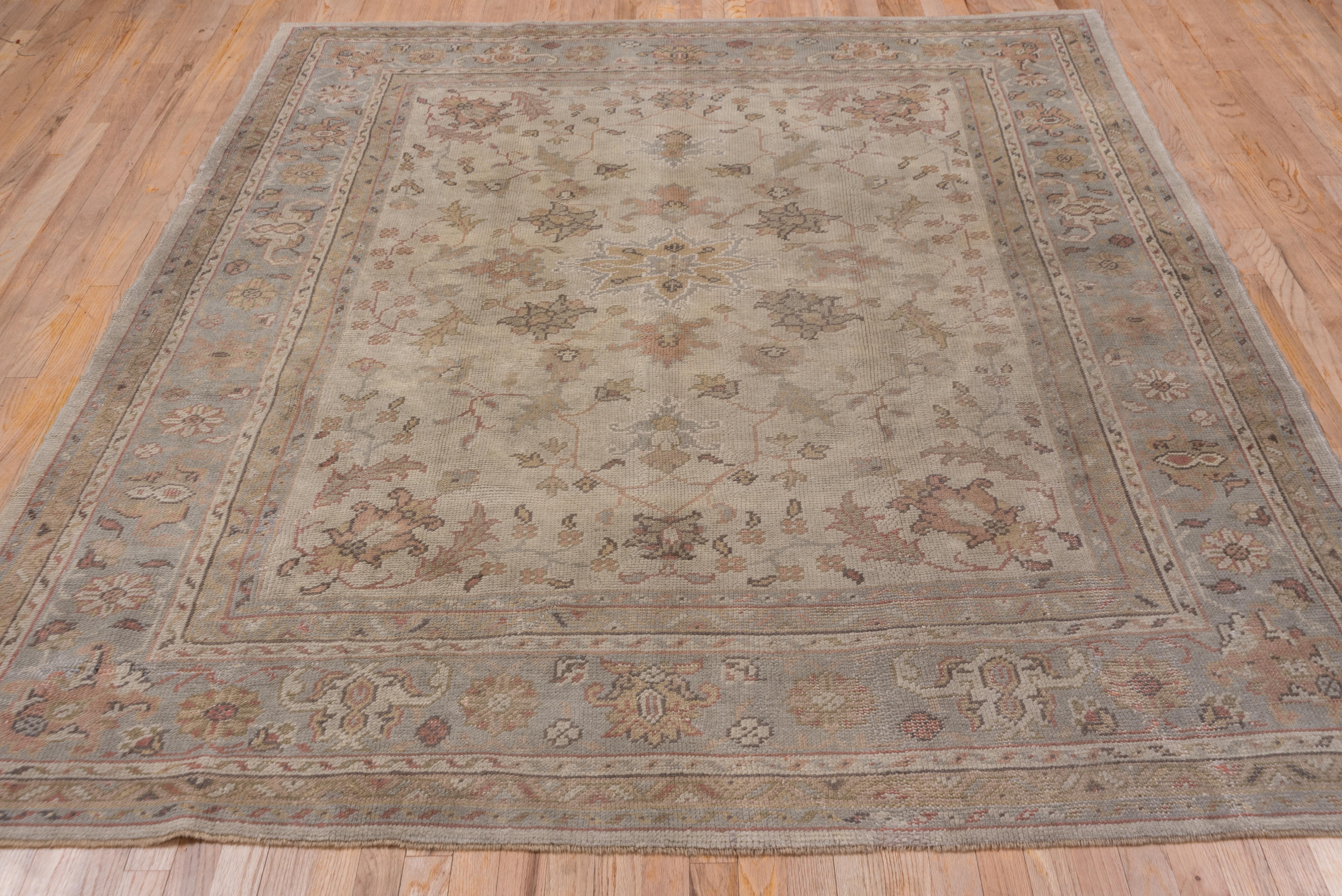 Hand-Knotted Antique Oushak Rug, Ivory Field, circa 1920s For Sale