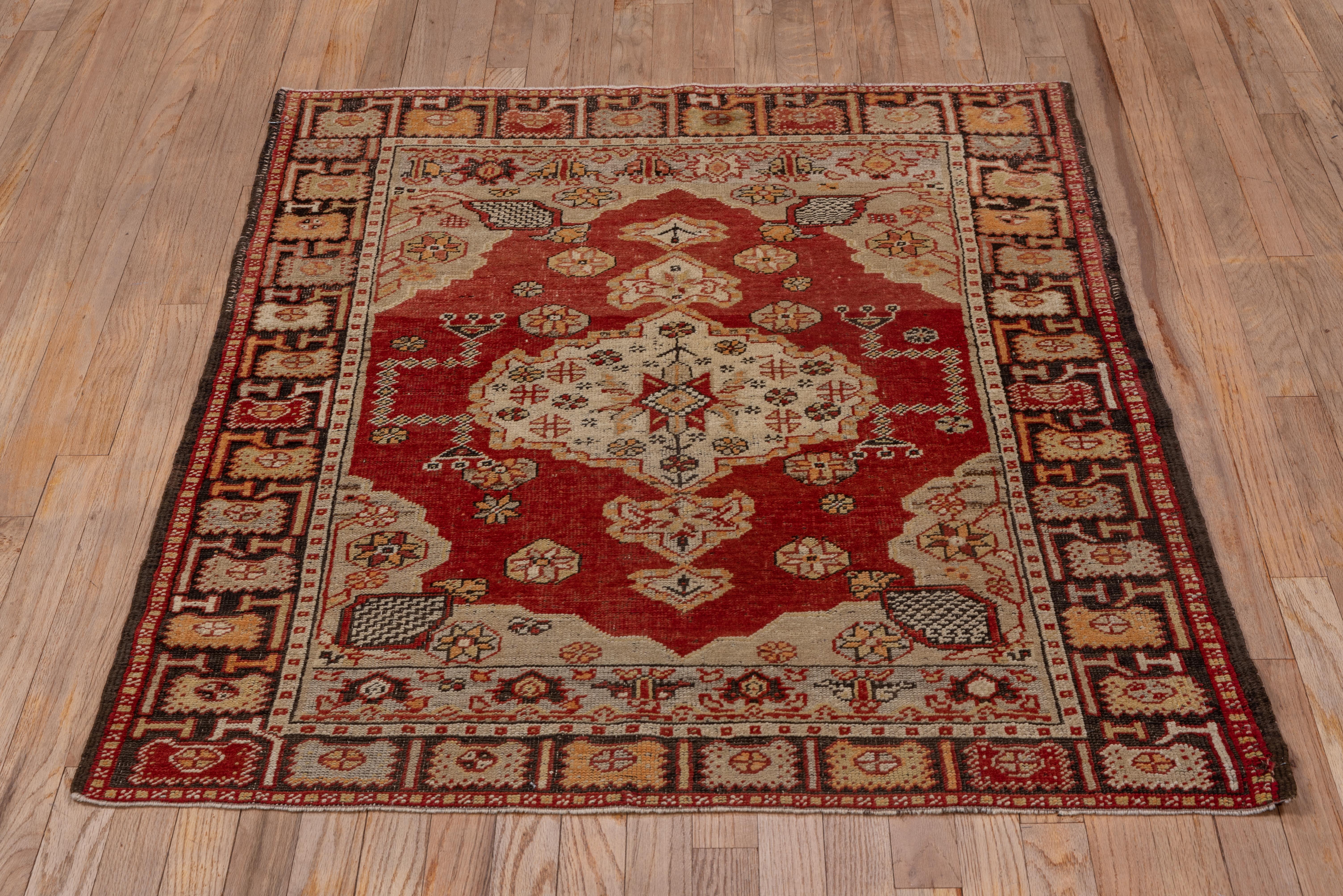Hand-Knotted Antique Oushak Rug, Red Field, circa 1920s For Sale
