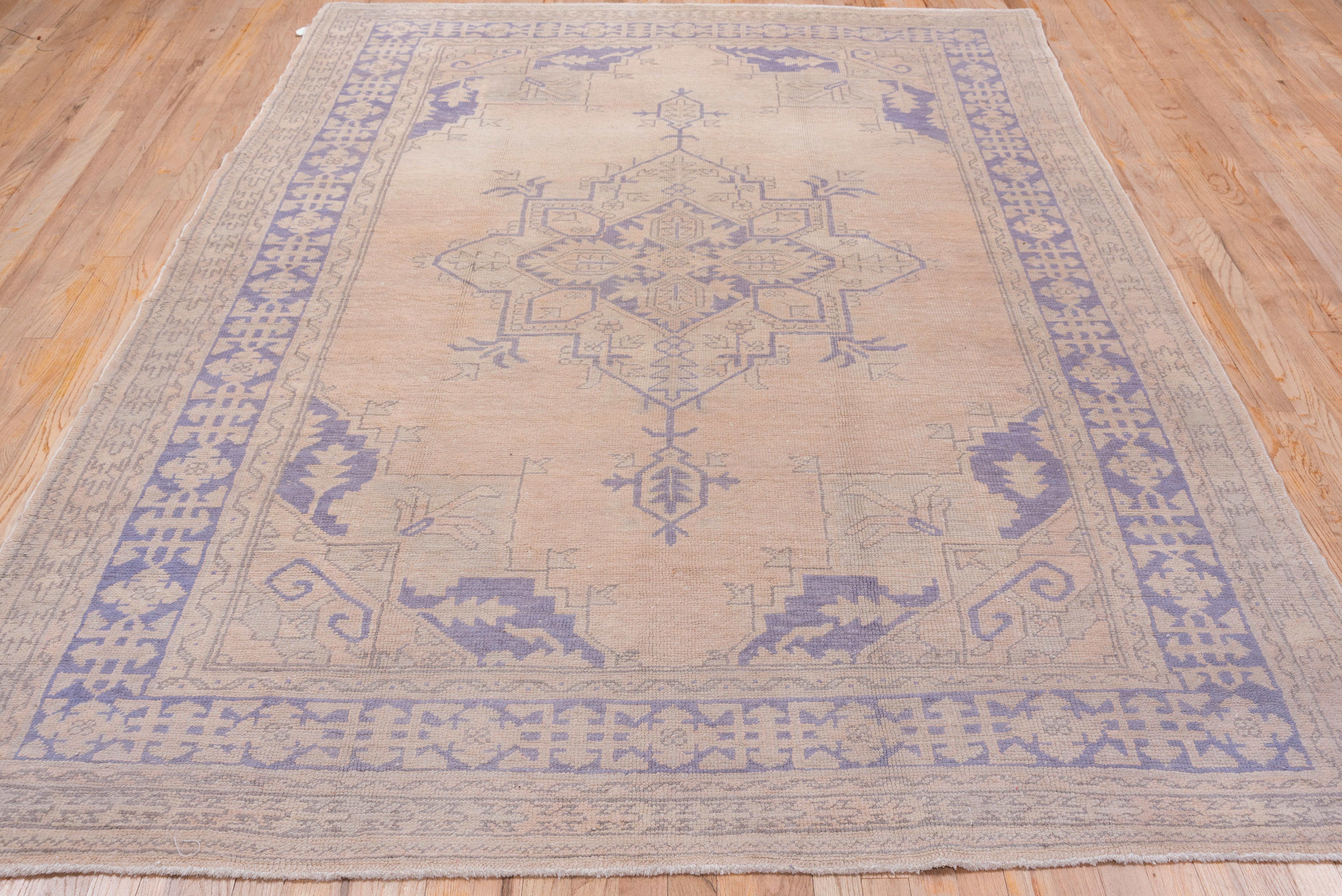 Turkish Antique Oushak Rug with a Light Palette For Sale