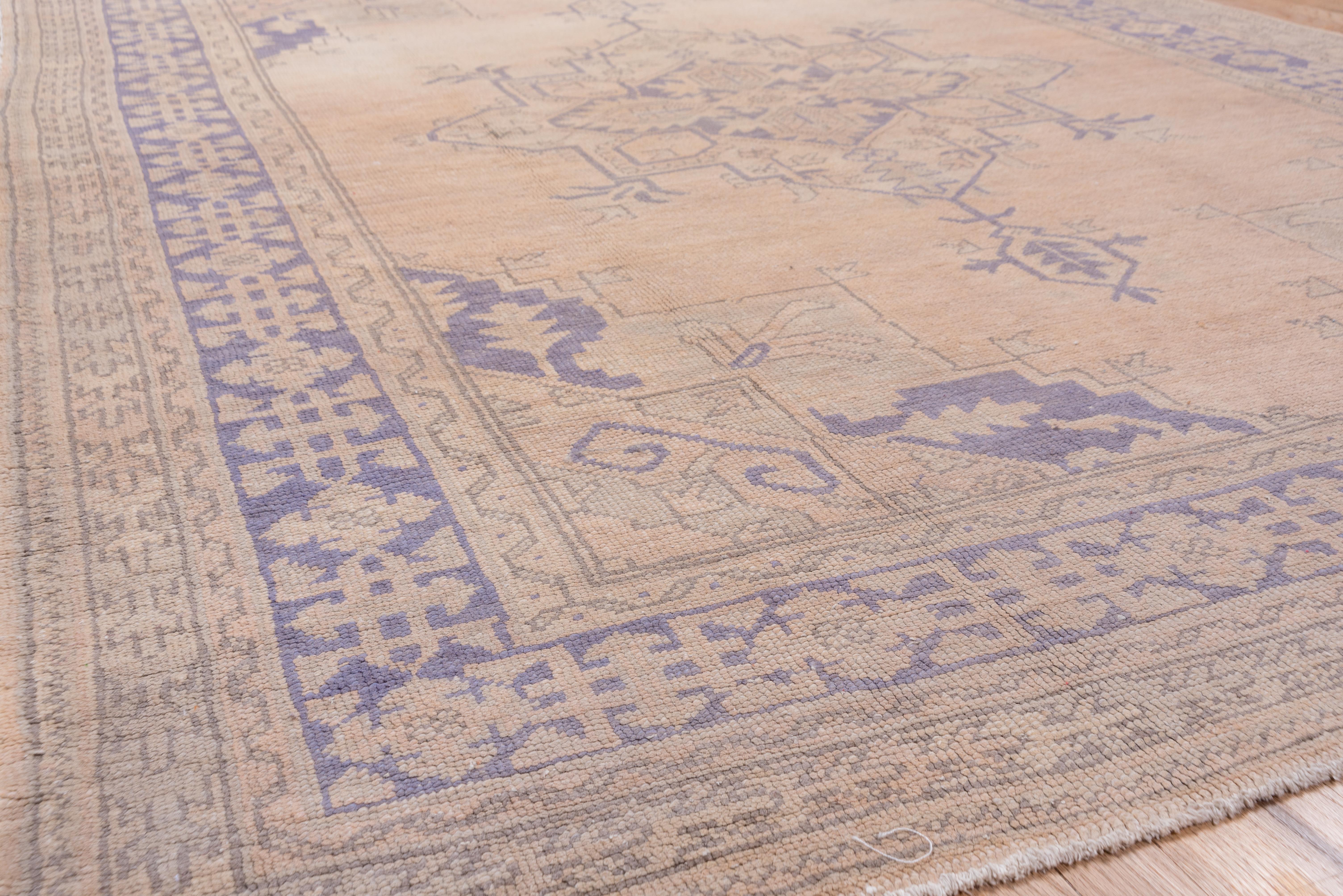 Wool Antique Oushak Rug with a Light Palette For Sale