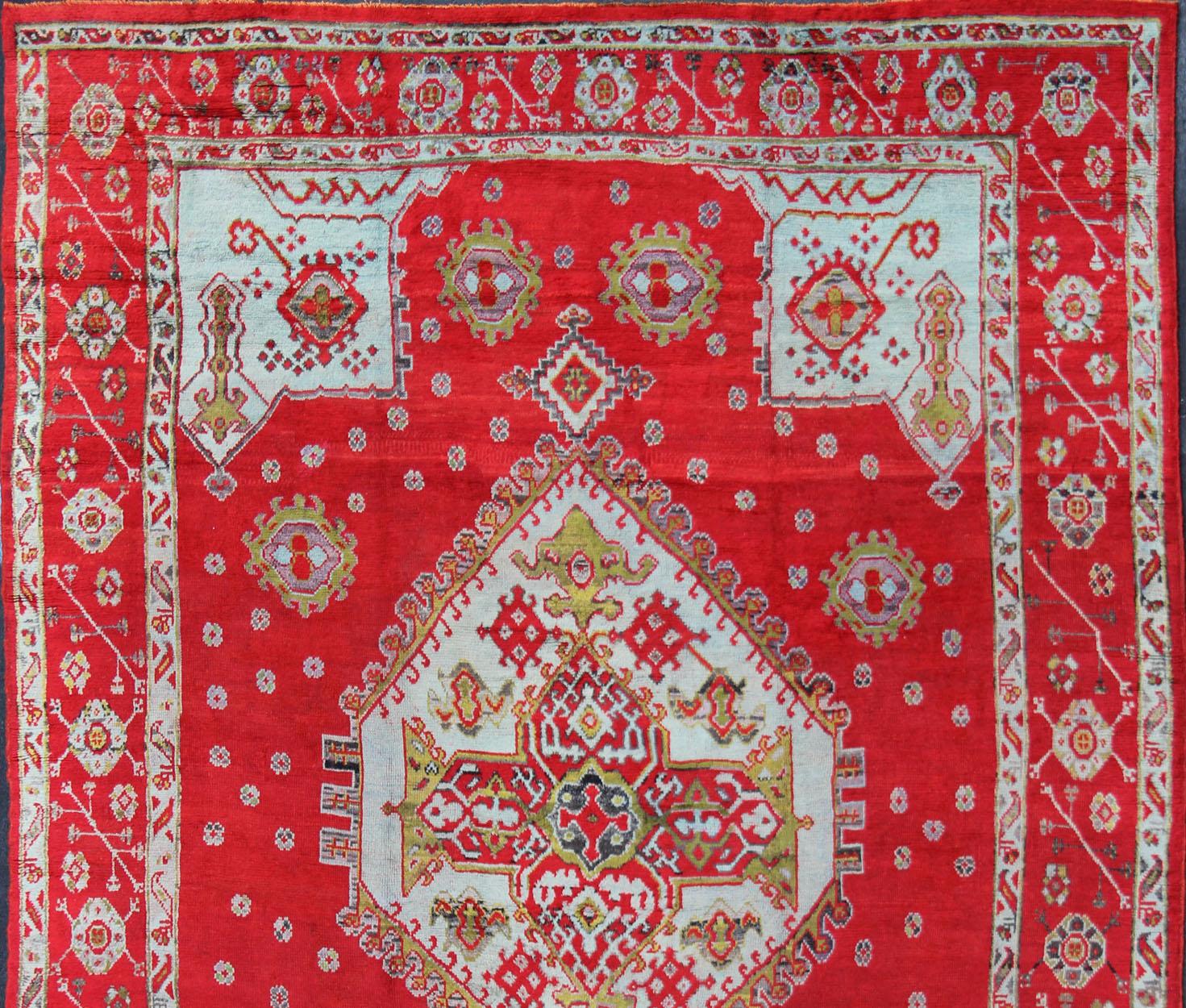 Large Antique Oushak Rug in Red, Acid Green and Ice Blue by Keivan Woven Arts
Antique Oushak rug with beautiful red, Keivan Woven Arts/ Rug/BHR-2

Measure: 12' x 16'5

This lovely antique Oushak has a bold geometric medallion with four elegant