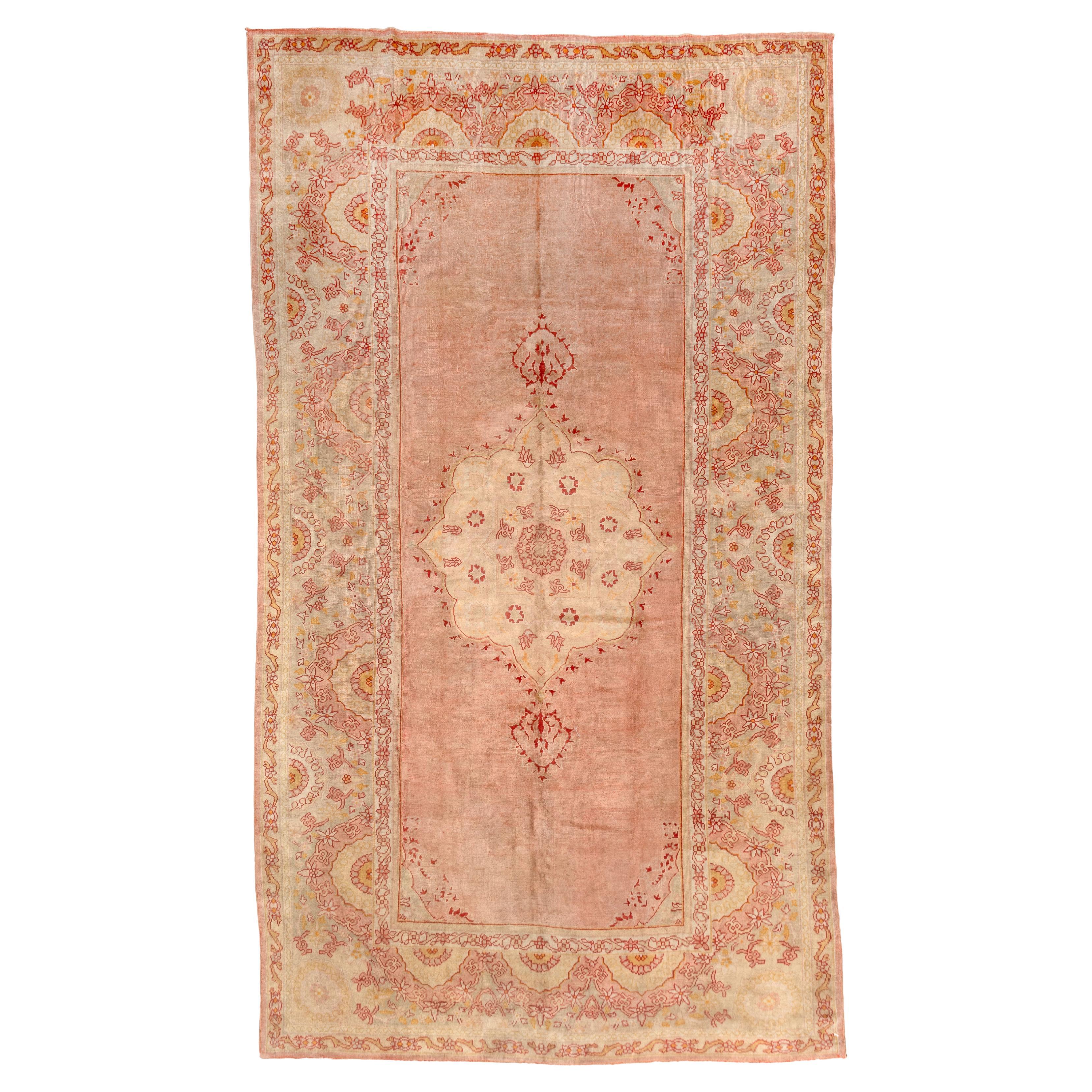 Antique Oushak Rug with Red Pink Tones