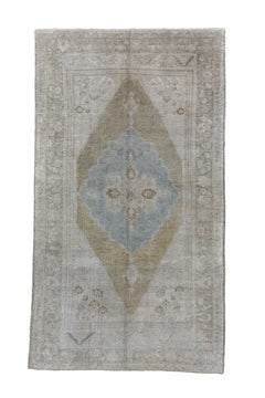 Antique Oushak Rug with Teal Medallion on a Plain Field