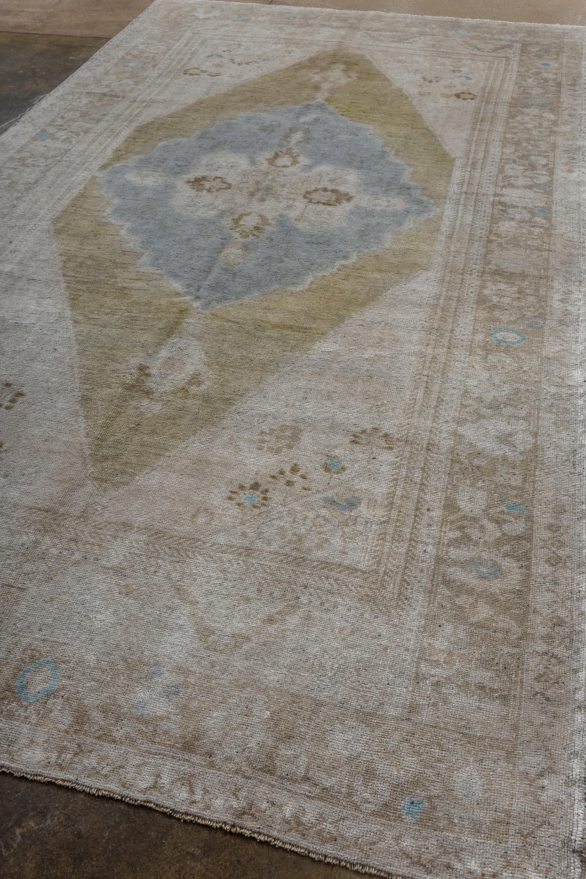 Turkish Antique Oushak Rug with Teal Medallion on a Plain Field  For Sale