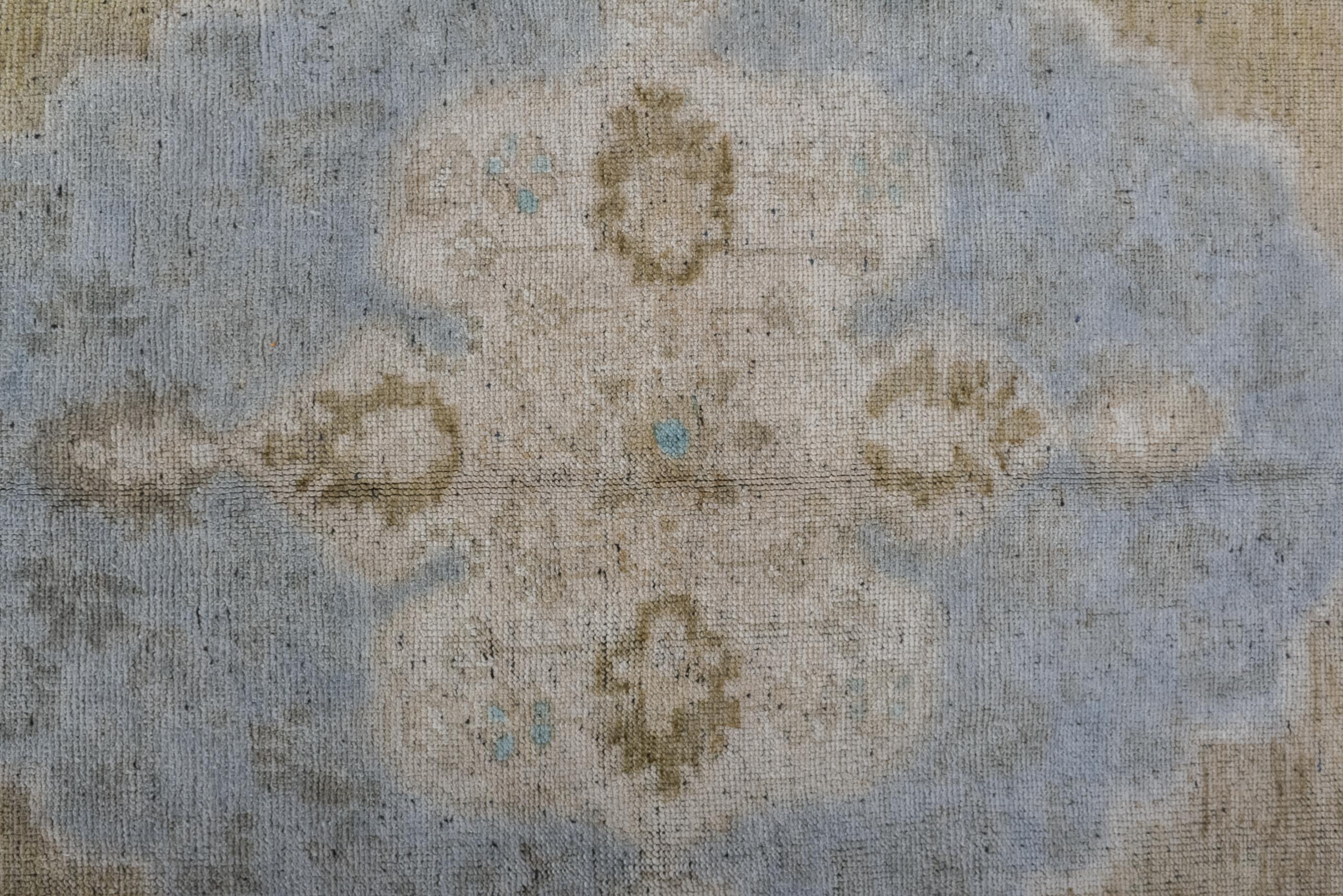 Hand-Knotted Antique Oushak Rug with Teal Medallion on a Plain Field  For Sale