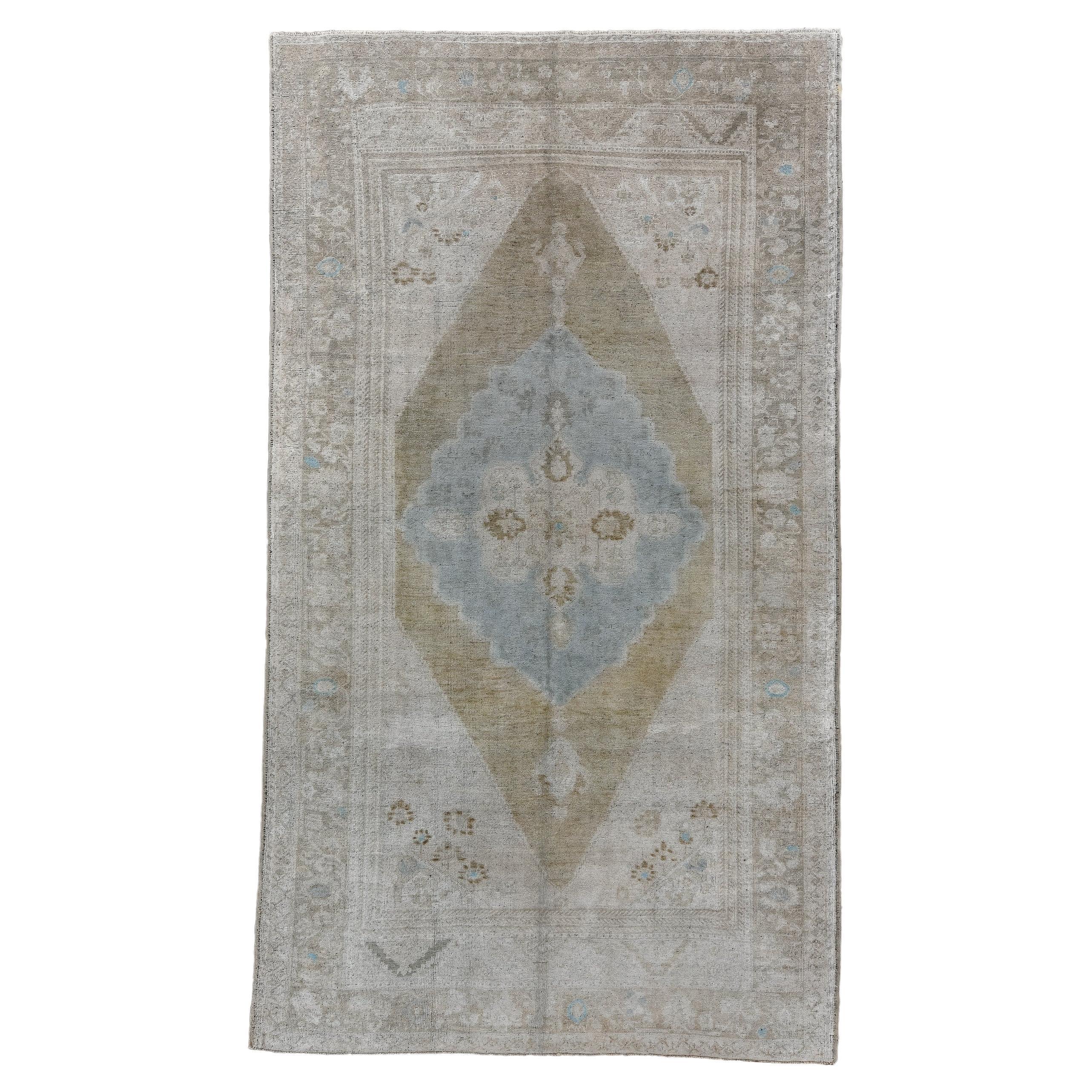 Antique Oushak Rug with Teal Medallion on a Plain Field  For Sale