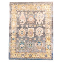Tapis ancien d'Oushak à la palette vibrante