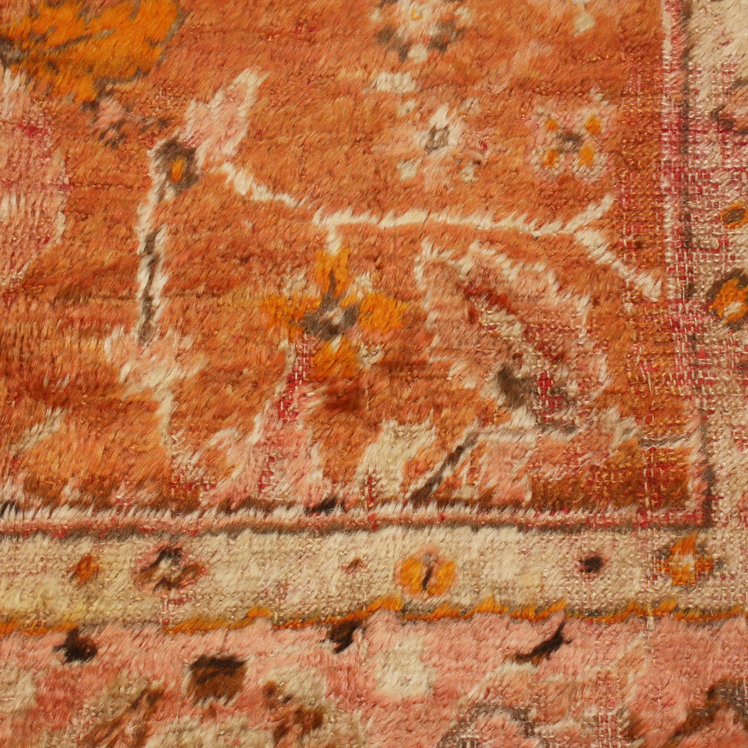 Antique Oushak Rug in Orange with Pink Floral Patterns In Good Condition For Sale In Long Island City, NY