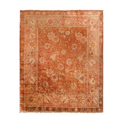 Antique Oushak Salmon and Copper Geometric-Floral Wool Rug