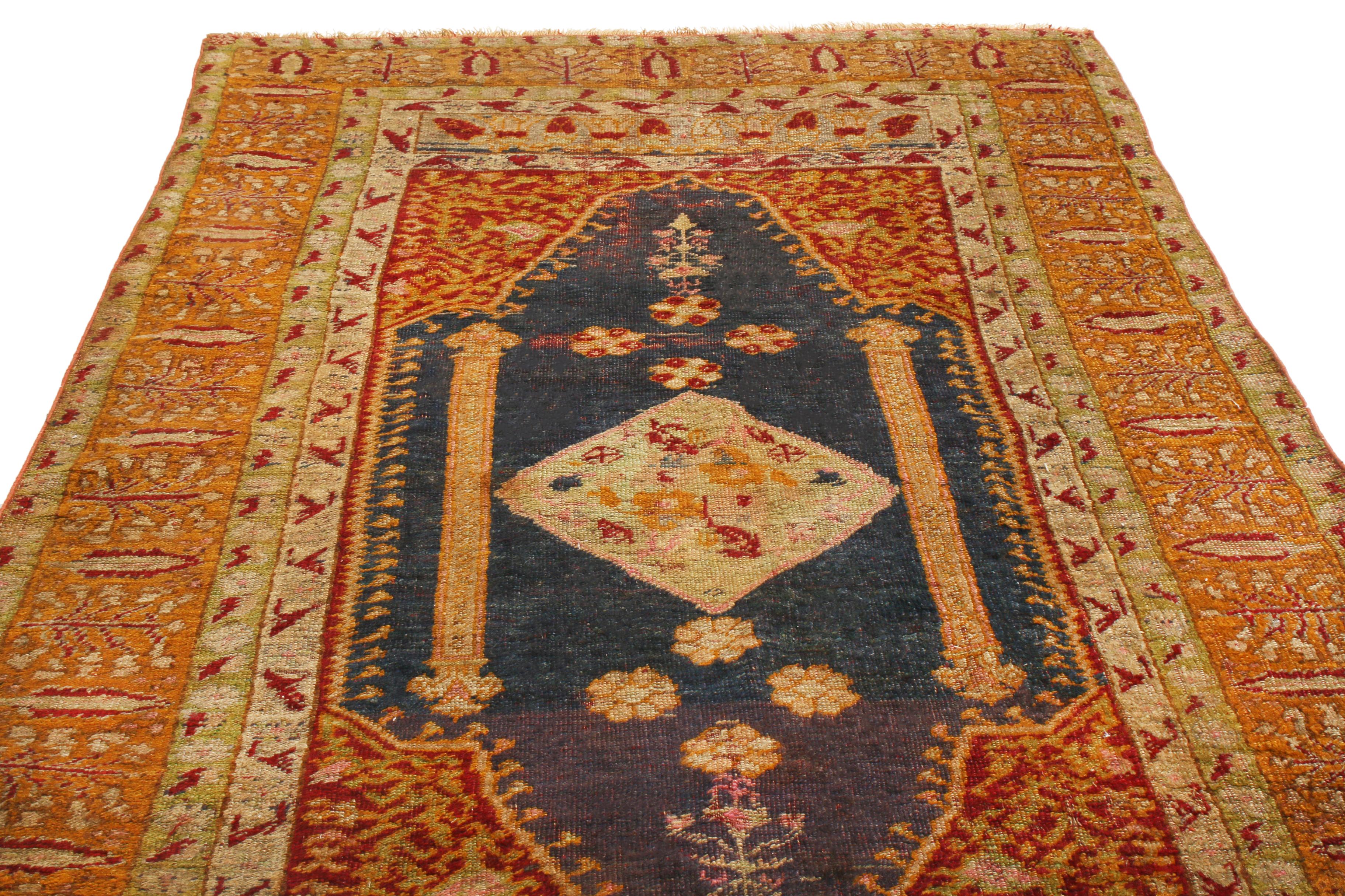 Originating from Turkey between 1890-1910, this antique traditional Oushak wool rug features a variation of notable tree of life symbols in its outer field and borders. Hand knotted in high quality wool, the central royal blue medallion bears