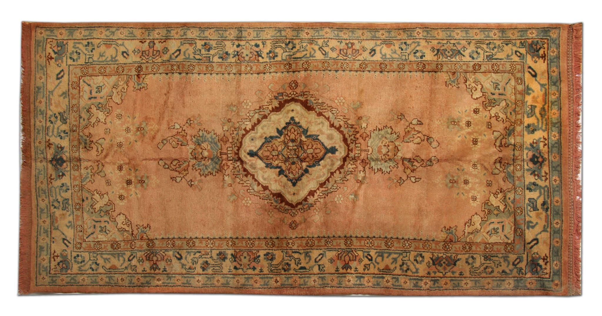 Introducing our exquisite antique rug, a timeless masterpiece that exudes elegance and heritage. Hand-knotted with precision and care, this rug carries the legacy of expert craftsmanship, dating back to the 1920s. Its dimensions of 305x150cm make it