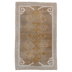 Antique Oushak with a Rust and Brown Field and an Art Deco Look