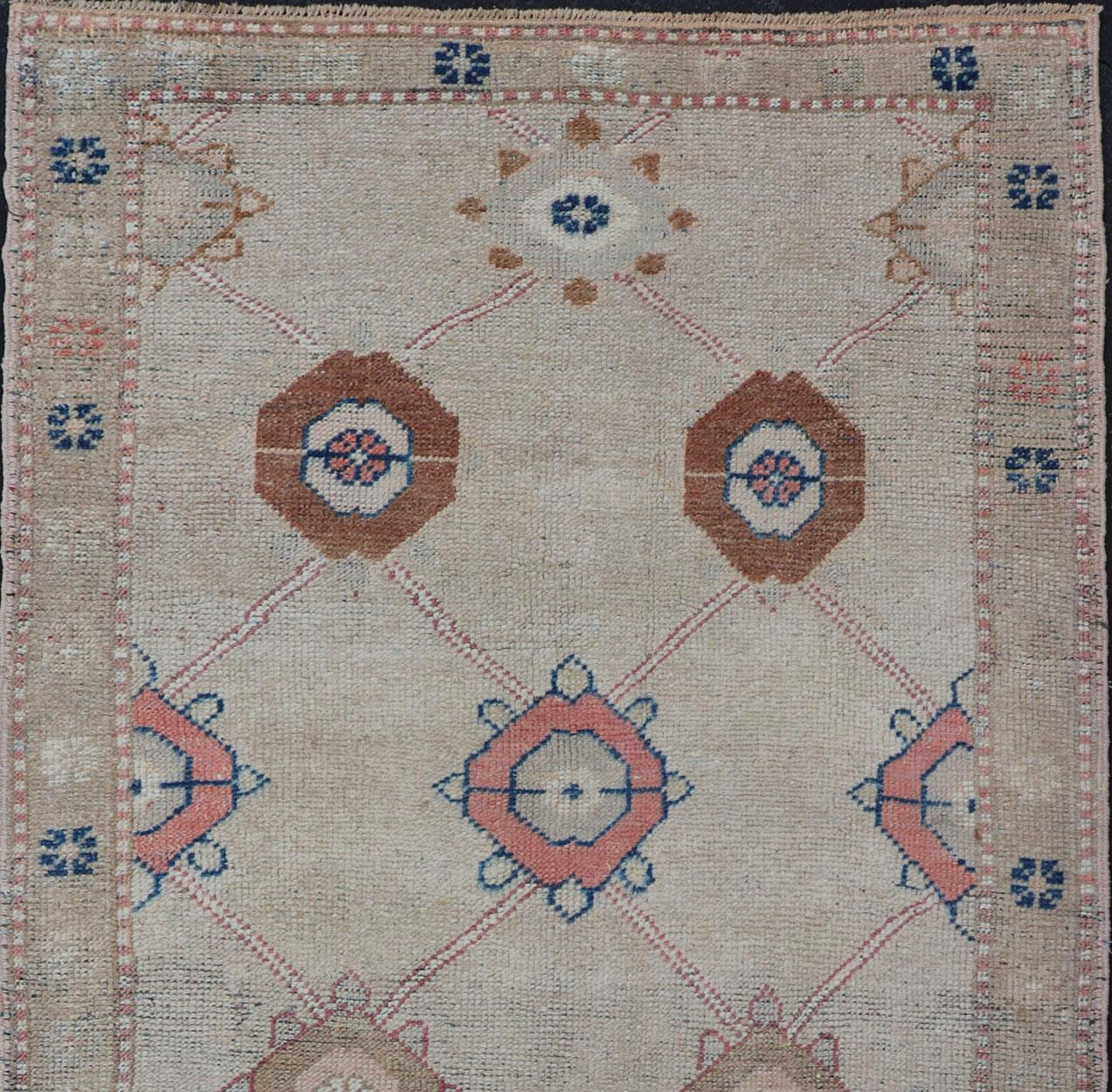 Hand-Knotted Antique Oushak with Sub-Geometric Design in Tan, Cream, Caramel, Pink & Blue 