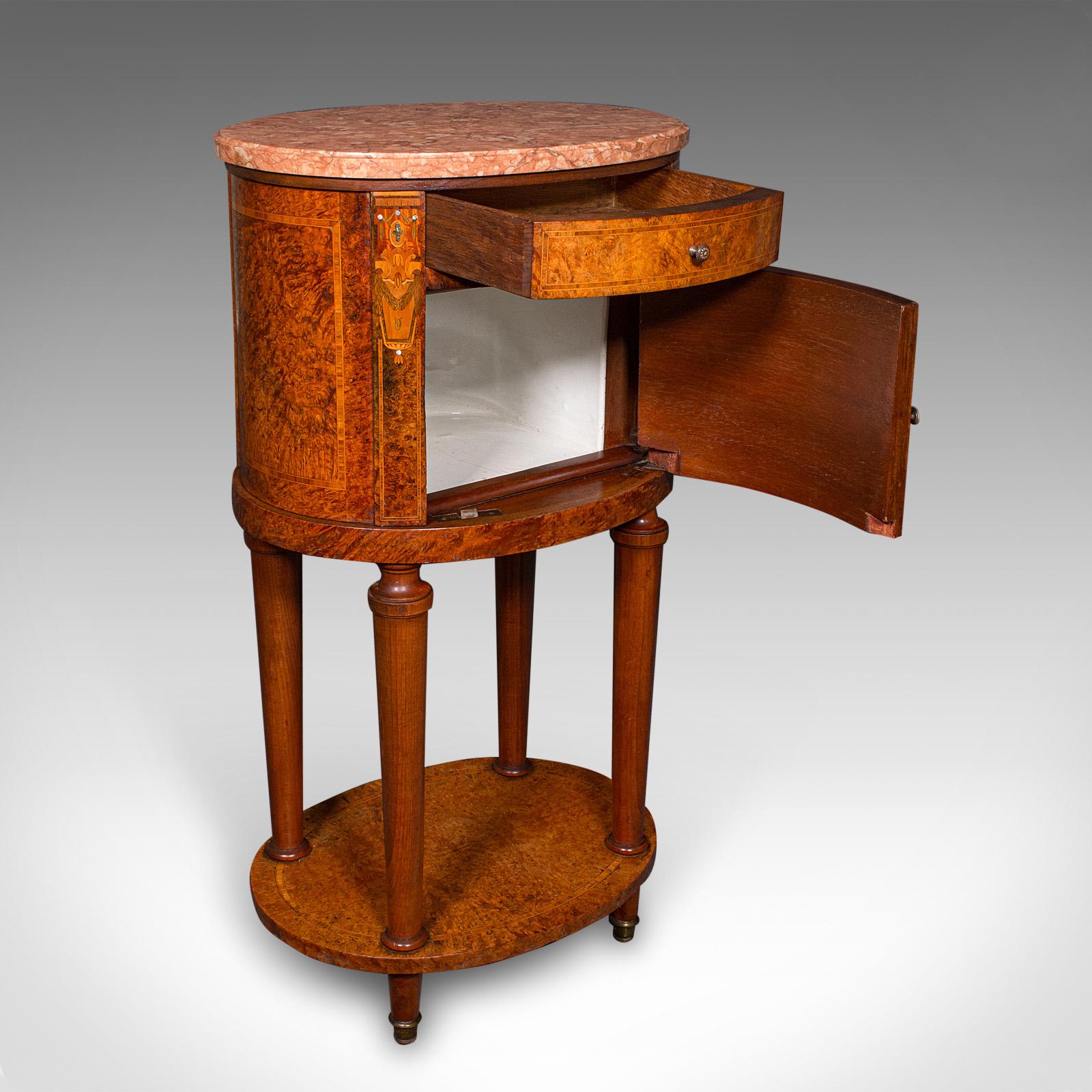
This is an antique oval bedside cabinet. A French, Amboyna and marble boudoir or bathroom nightstand, dating to the Victorian period, circa 1870.

Rare and exquisite, a fine example of French craftsmanship
Displays a desirable aged patina and in