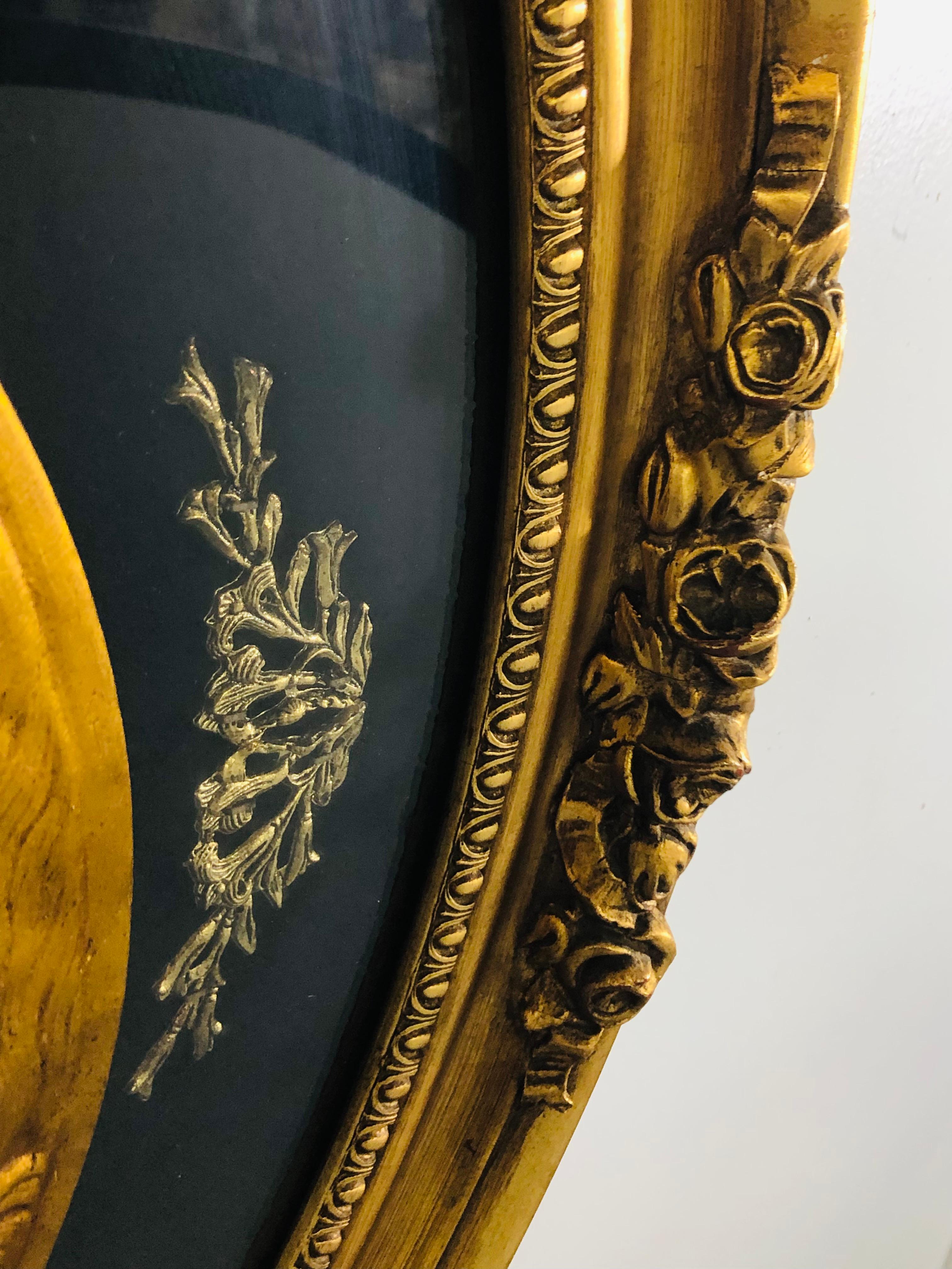 Antike ovale schwarz-goldene geflügelte Cherubs-Wandtafel, Wandkunst  im Angebot 5