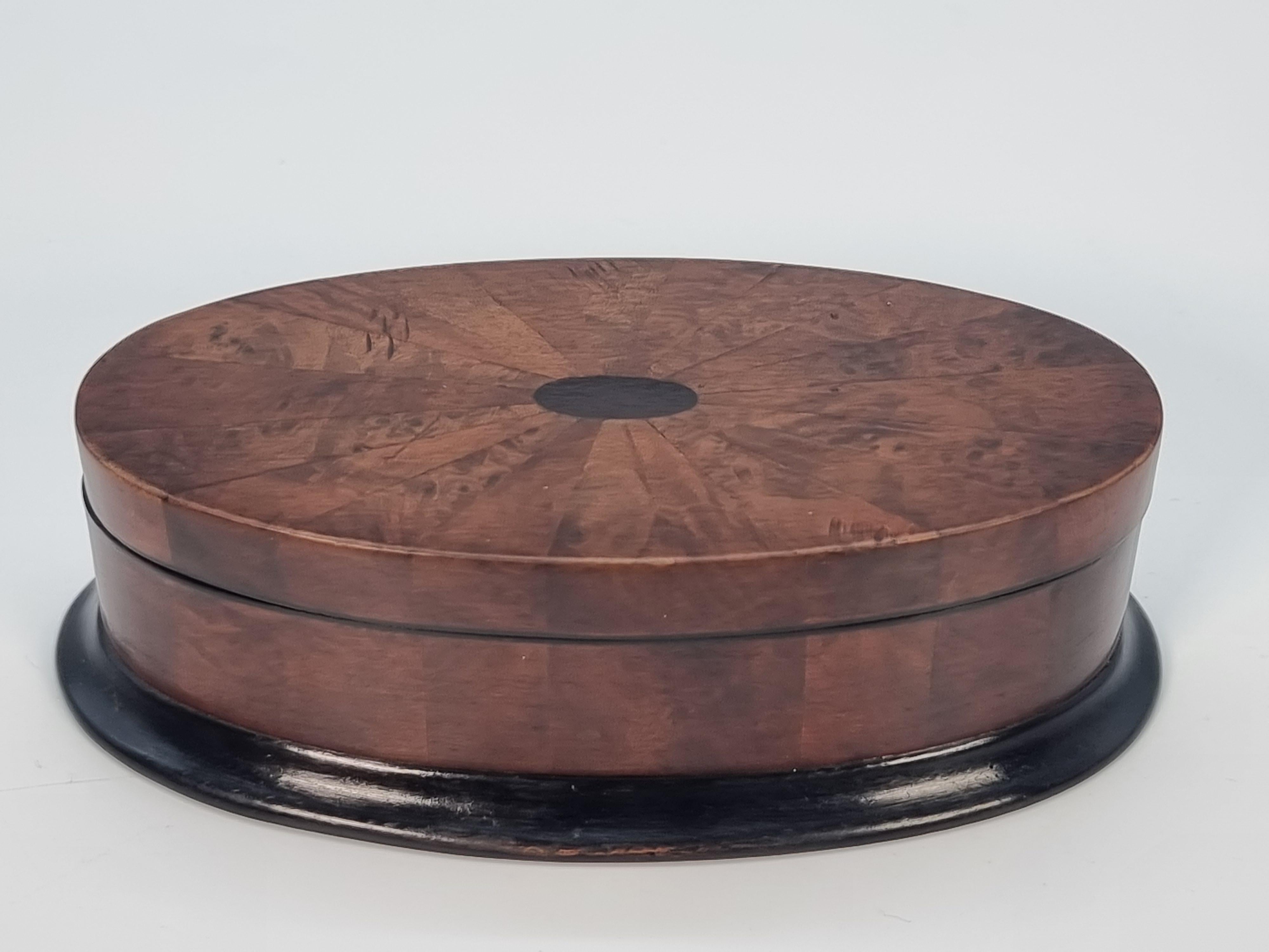 Hand-Crafted Antique oval box veneered in segments of various woods, English circa 1910 For Sale