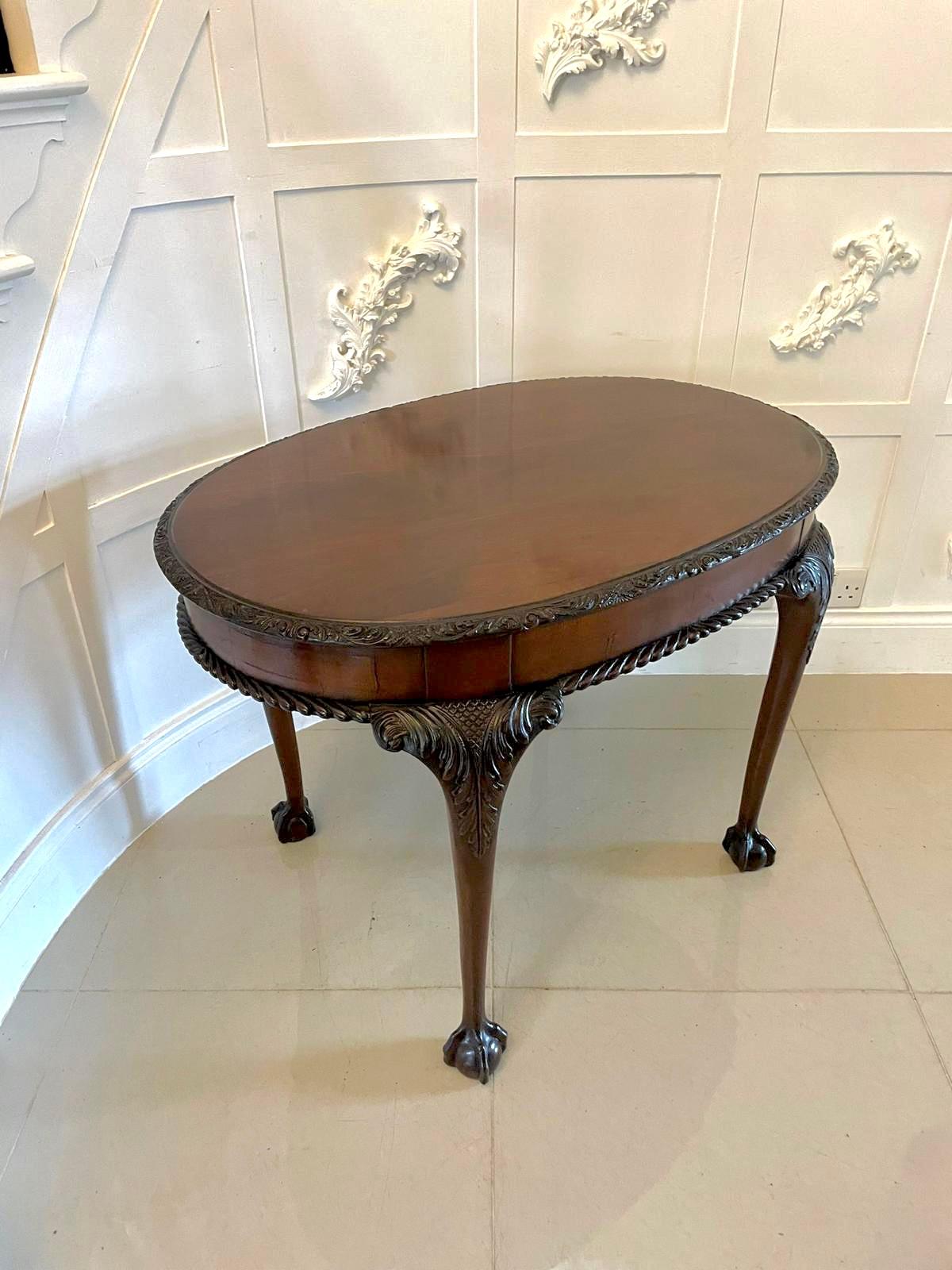 Antique oval carved mahogany centre table with a lovely figured mahogany top, carved moulded edge and mahogany apron with a gadrooned edge. It stands on four elegantly carved claws.

In lovely original condition and boasting a delightful colour
